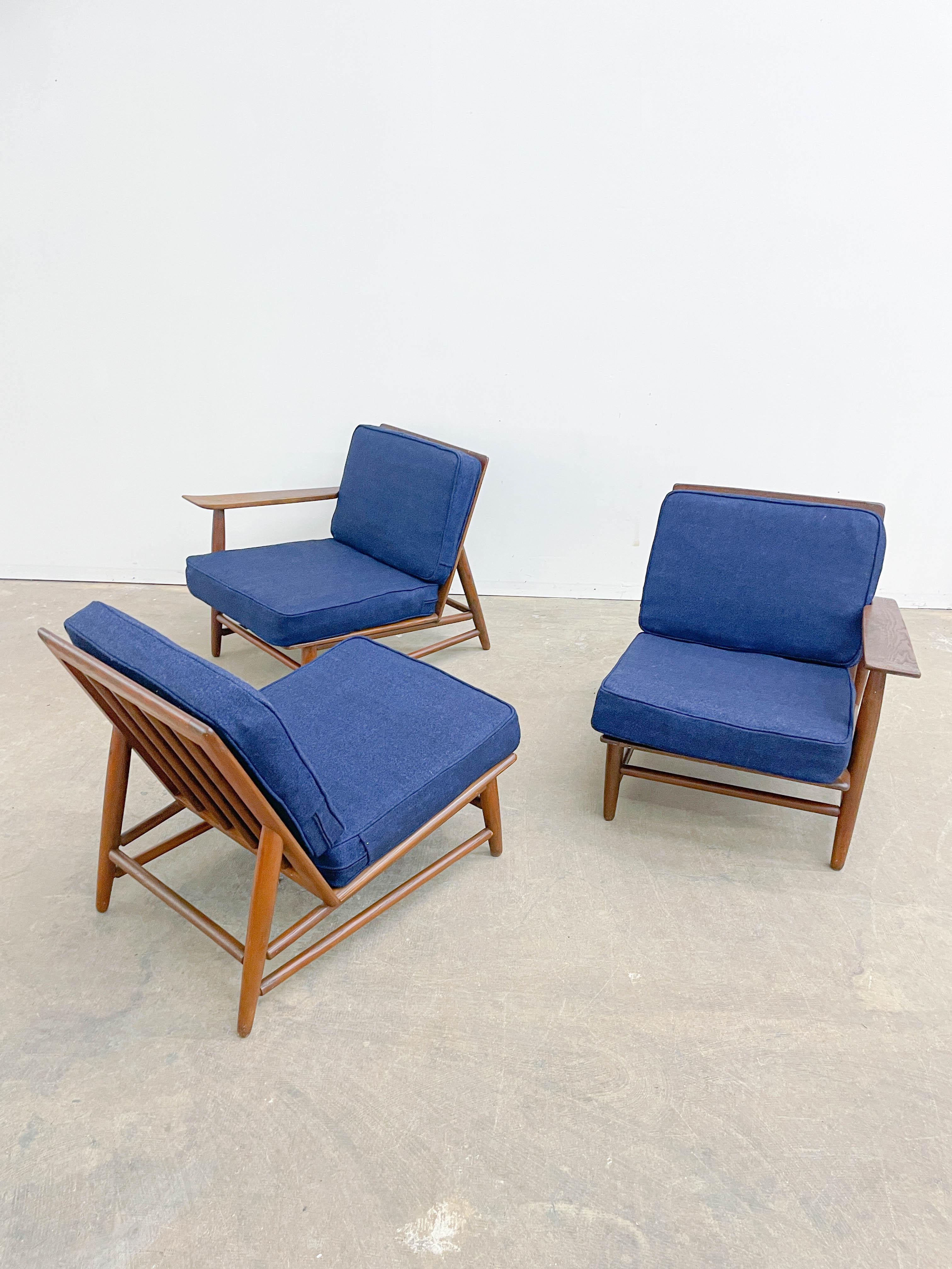 Modular seating made by Heywood Wakefield in the 1950s, strongly influenced by George Nakashima’s designs. With its subtly upturned plank arm rests and spindle stretchers these chairs are a nice combination of Japanese and Danish modernism. New