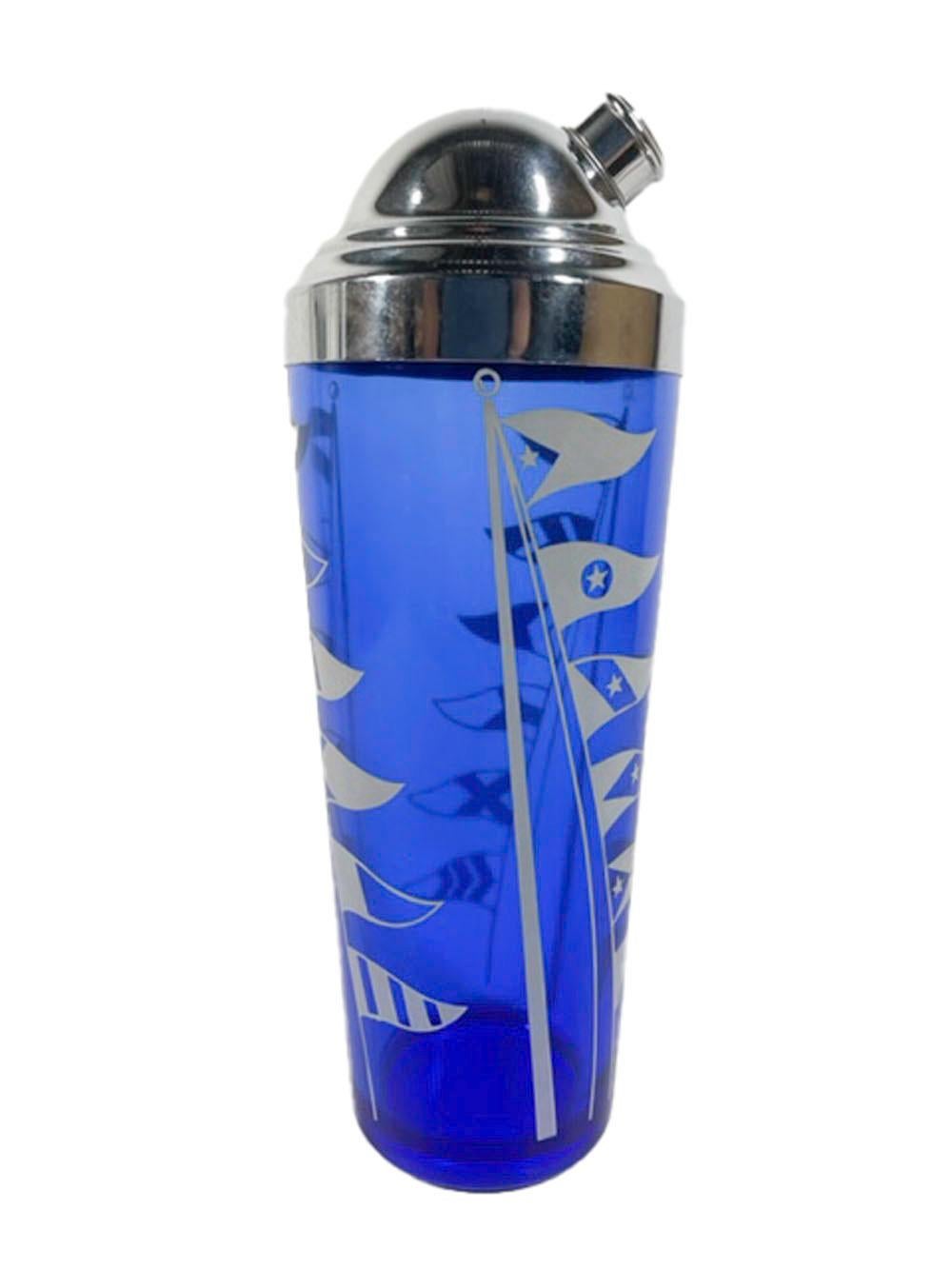 Art Deco cocktail shaker made by Hazel-Atlas, for their Sportsman Series in cobalt glass with white nautical flags and domed chrome lid.