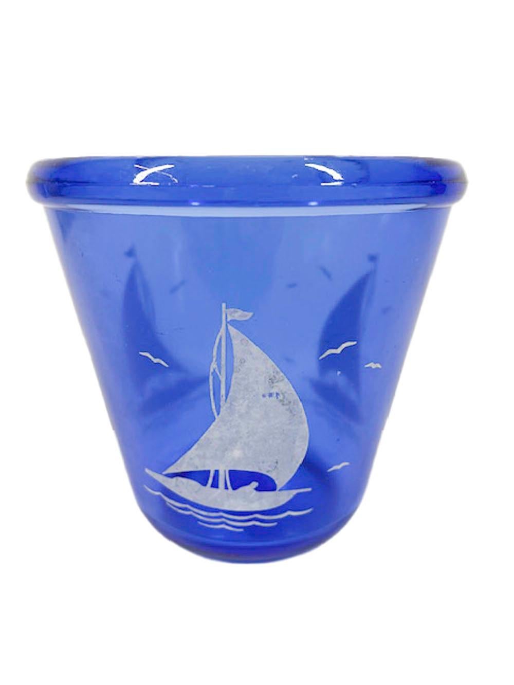 Art Deco ice bowl of tapered form with rolled rim, from Hazel-Atlas' Sportsman Series in cobalt glass with white sail boats.