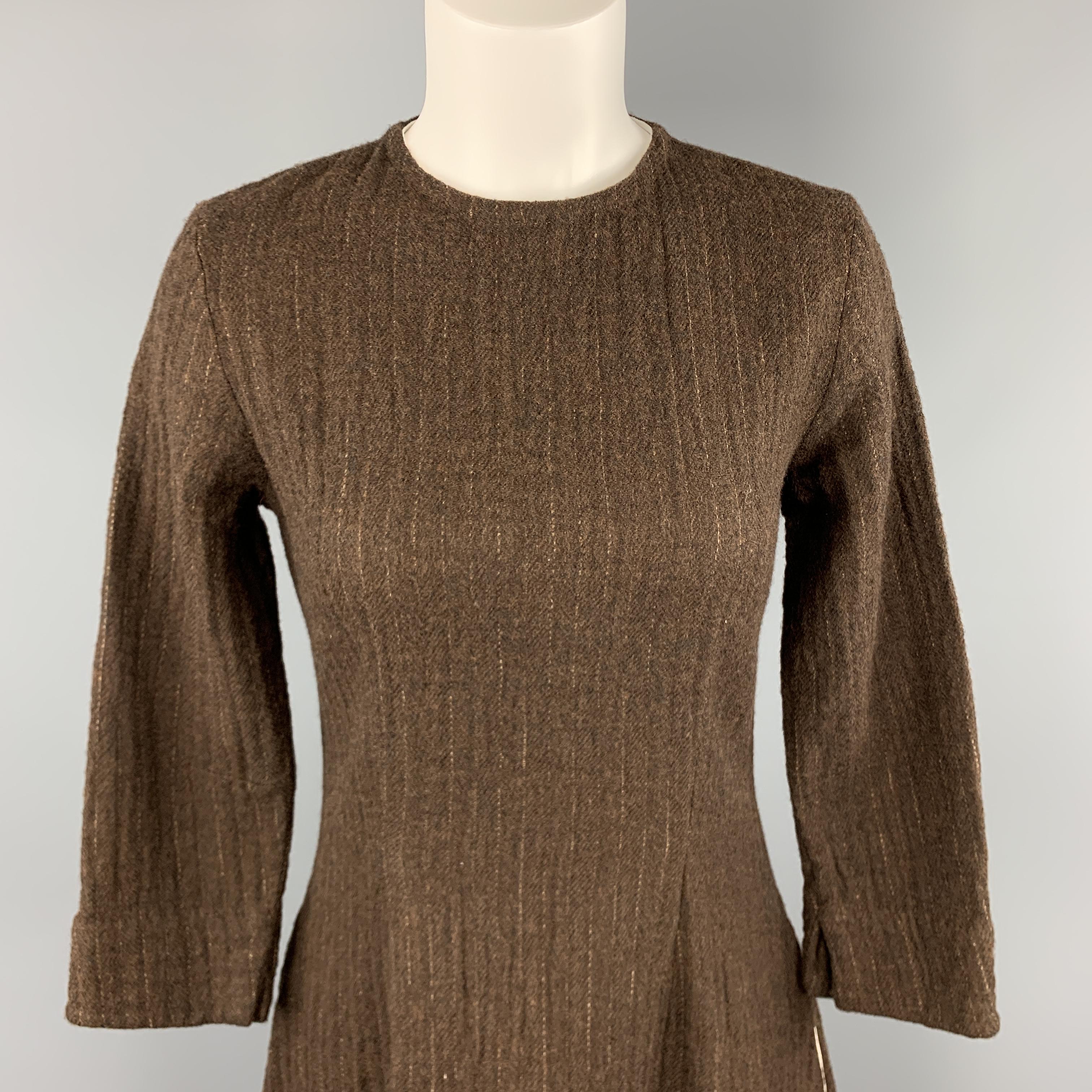 HAZEL BROWN shift dress comes in a brown textured knit with a round neck, long sleeves, and A line skirt. Made in USA.

Excellent Pre-Owned Condition.
Marked: 2

Measurements:

Shoulder: 15 in.
Bust: 36 in.
Waist: 29 in.
Hip: 44 in.
Sleeve: 20