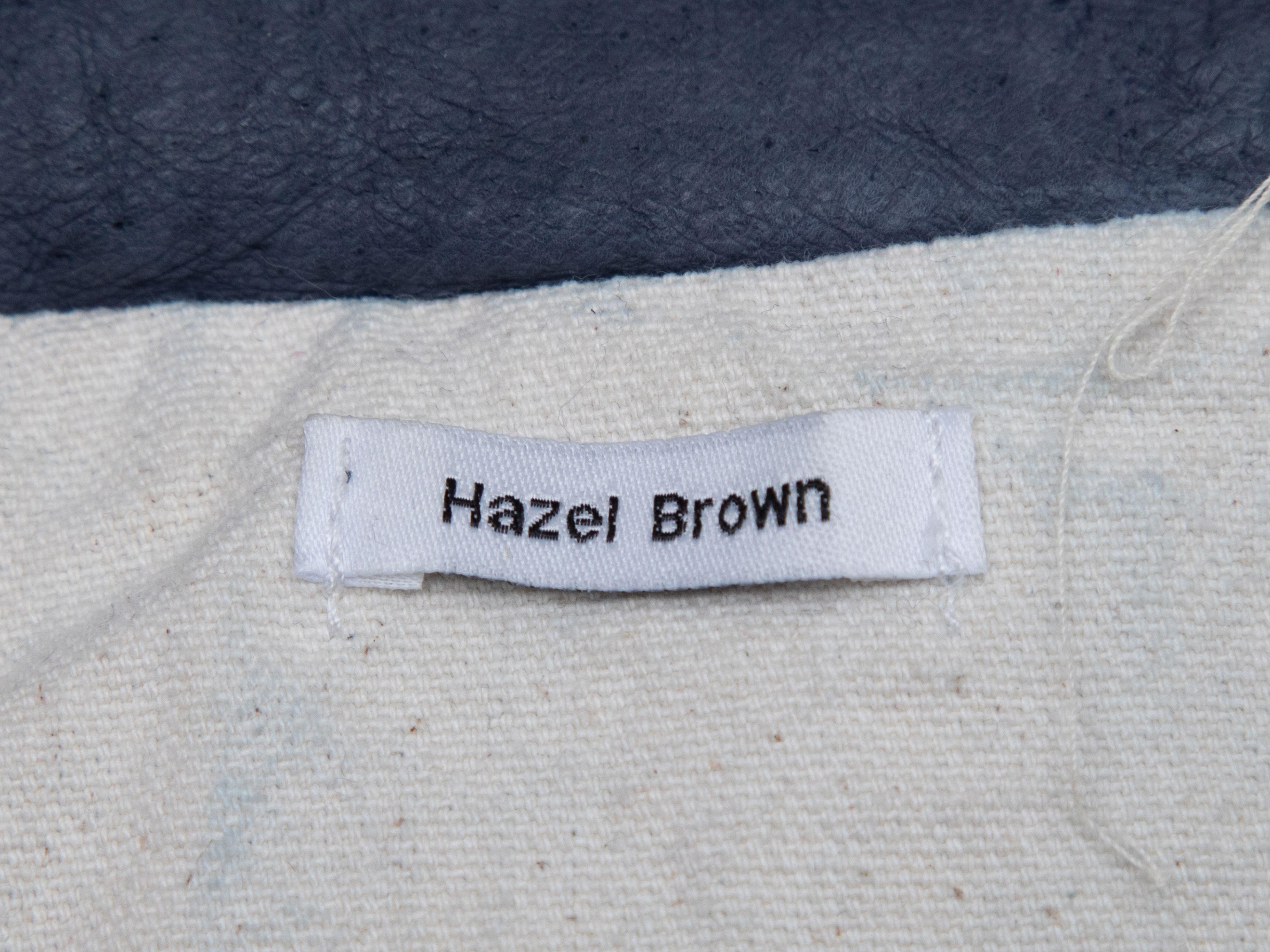 Product Details: Navy leather hooded jacket by Hazel Brown. Four flap pockets at front. Zip closure at center front. 40
