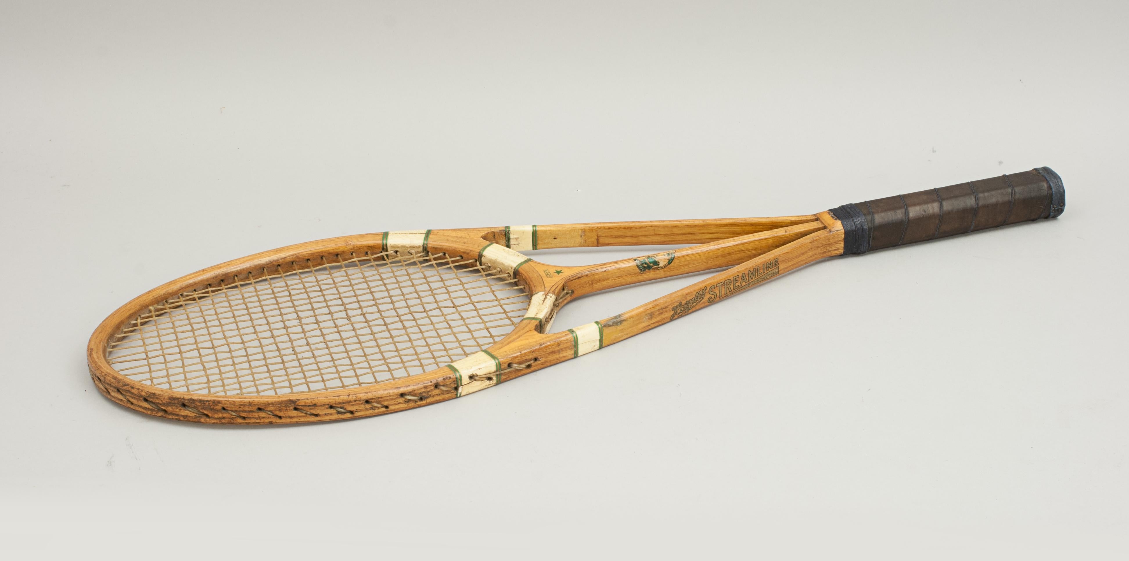 Hazell streamline tennis racket, green star.
A good triple branch green star streamline lawn tennis racket made by Hazells' of 111-113 Mare street, London E 8. The racket is in very good condition for its age, all transfers are bright in colour