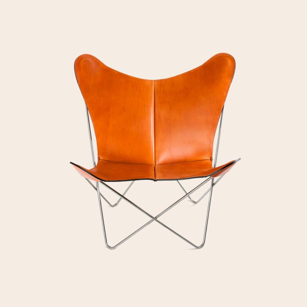Hazelnut and Steel Trifolium Chair by Ox Denmarq
Dimensions: D 69 x W 78 x H 86 cm
Materials: Leather, Textile, Stainless Steel
Also Available: Different leather colors and other frame color available.

Ox Denmarq is a Danish design brand