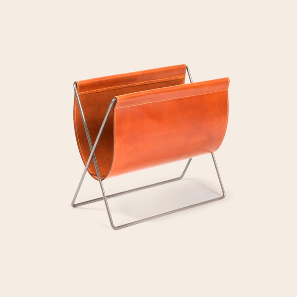 Hazelnut Leather and Steel Maggiz Magazine Rack by OxDenmarq
Dimensions: D 24 x W 47 x H 43 cm
Materials: Steel, Leather
Also Available: Different leather and frame colors available,

OX DENMARQ is a Danish design brand aspiring to make