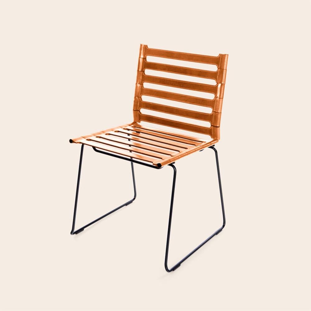 Hazelnut strap chair by Ox Denmarq.
Dimensions: D 45 x W 45 x H 78.5 cm.
Materials: leather, black powder coated steel.
Also available: different colors available.

Ox Denmarq is a Danish design brand aspiring to make beautiful handmade