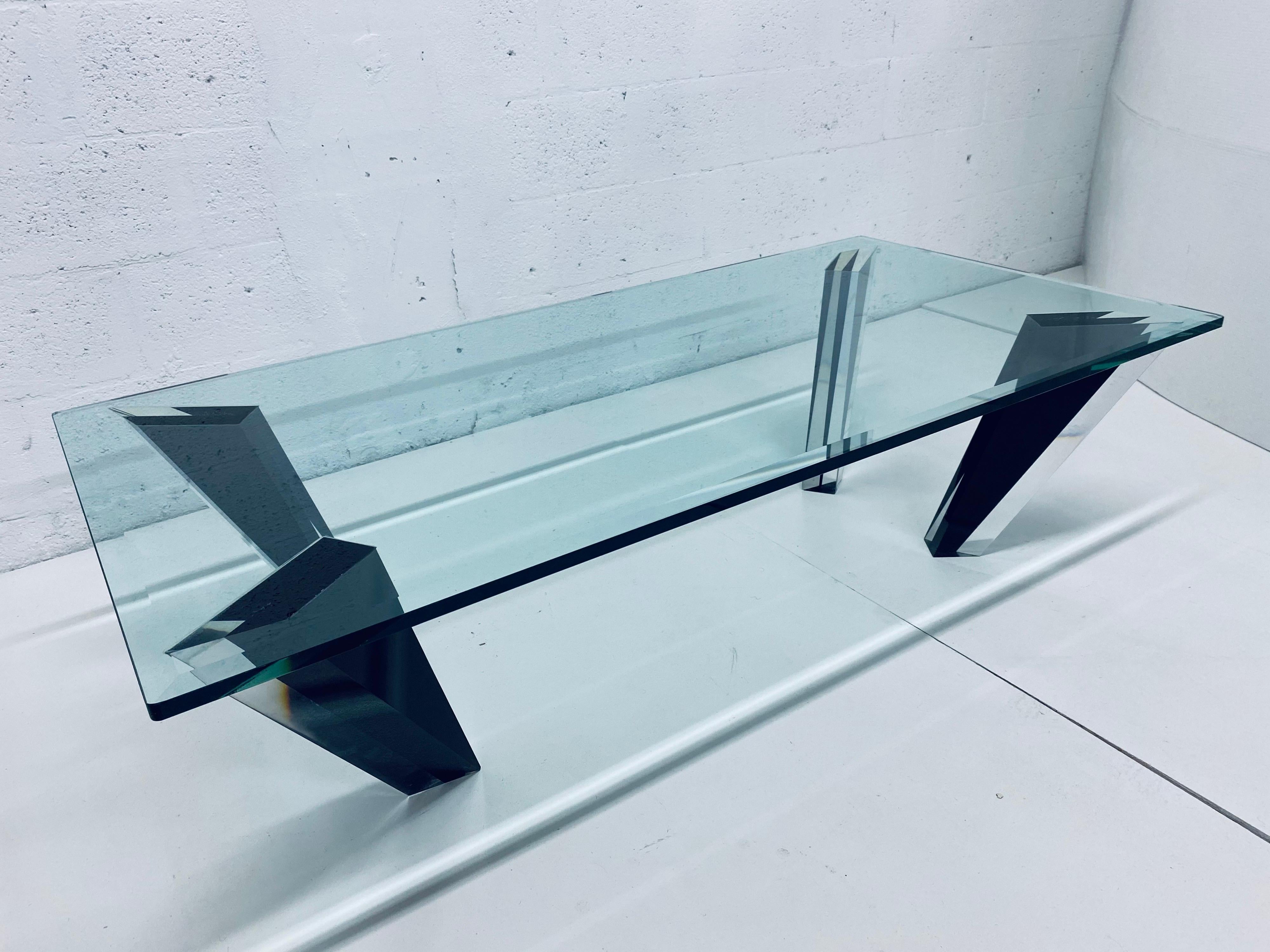 Haziza coffee table with faceted black and clear lucite legs and a 3/4