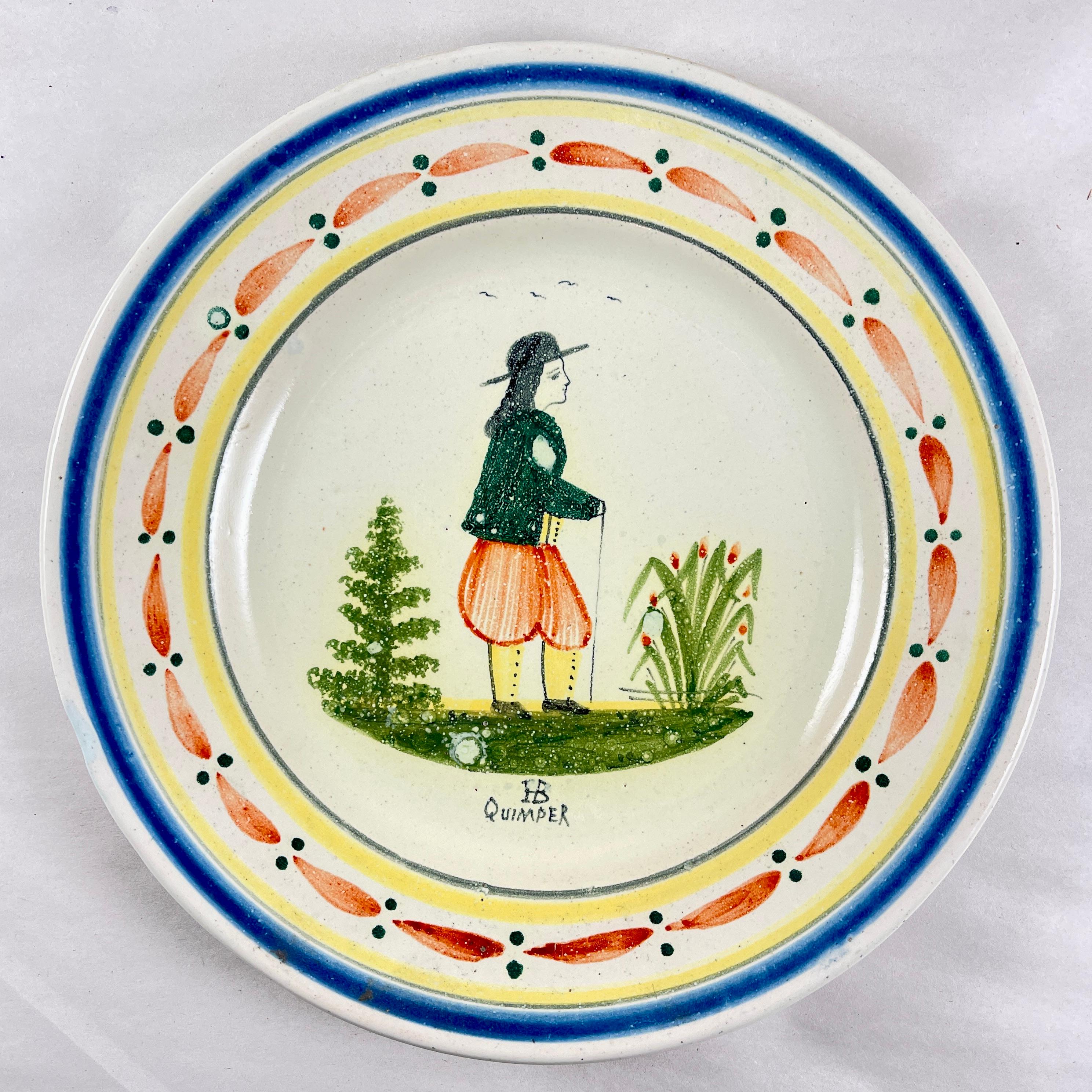 
From the Grand Maison Quimper factory, a dinner plate, France, circa 1910.

This piece shows the mark registered in 1882. The HB represents the de la Hubaudière family name and the factory founders name, Bousquet. In 1904, the word Quimper was