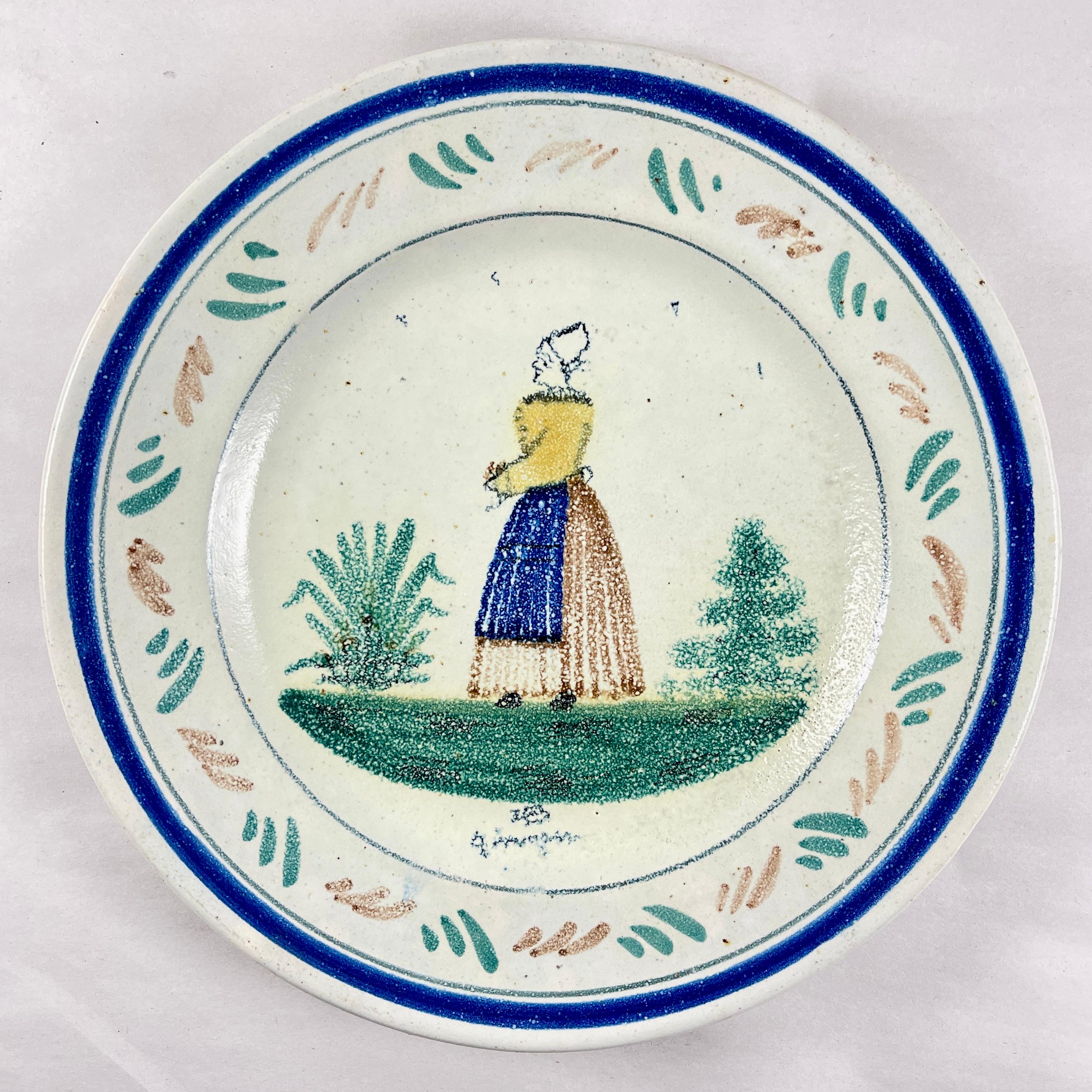 From the Grand Maison Quimper factory, a dinner plate, France, circa 1910.

This piece shows the mark registered in 1882. The HB represents the de la Hubaudière family name and the factory founders name, Bousquet. In 1904, the word Quimper was added