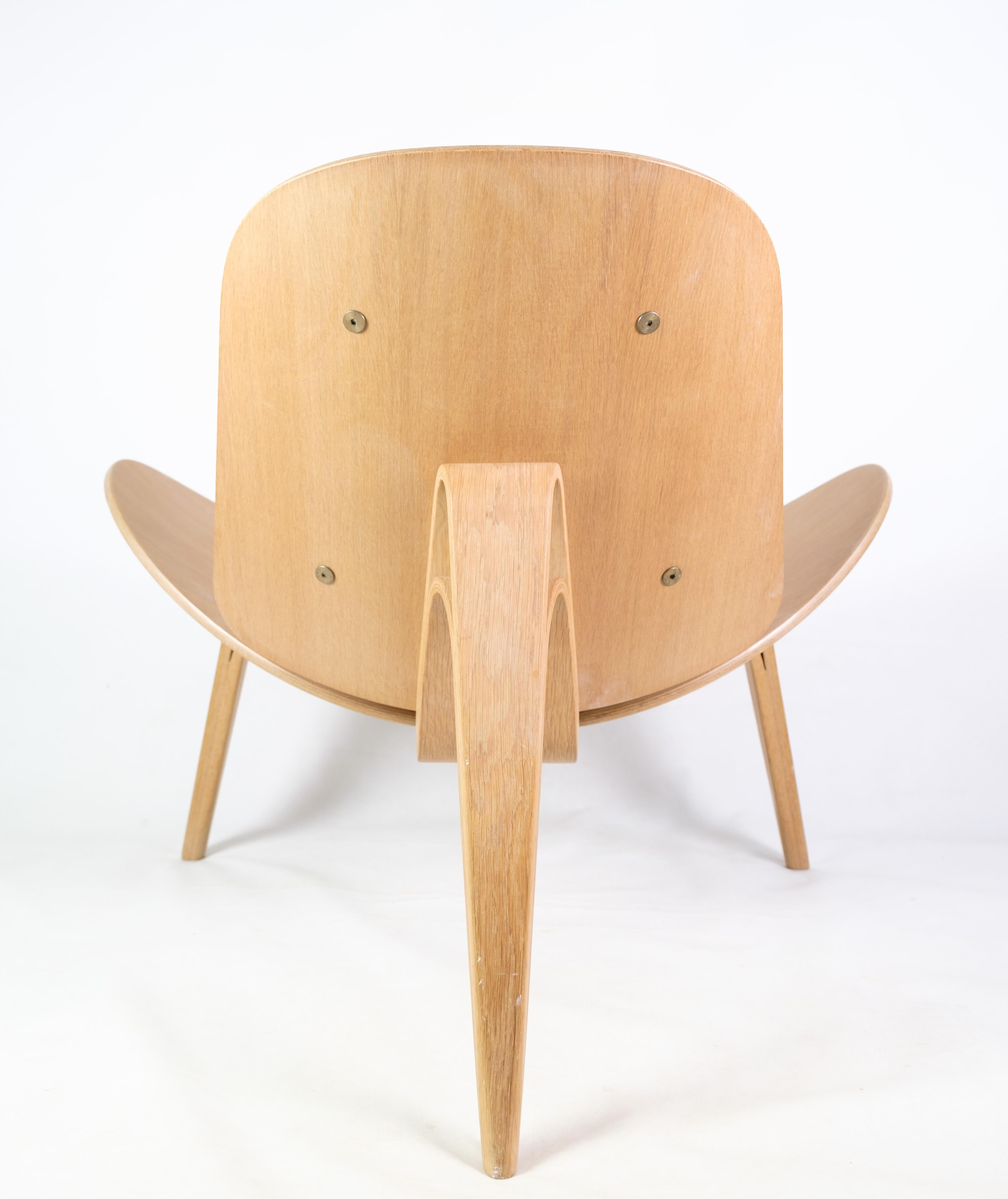 Leather he shell chair model CH07, designed by Hans J. Wegner, made of oak from 2007