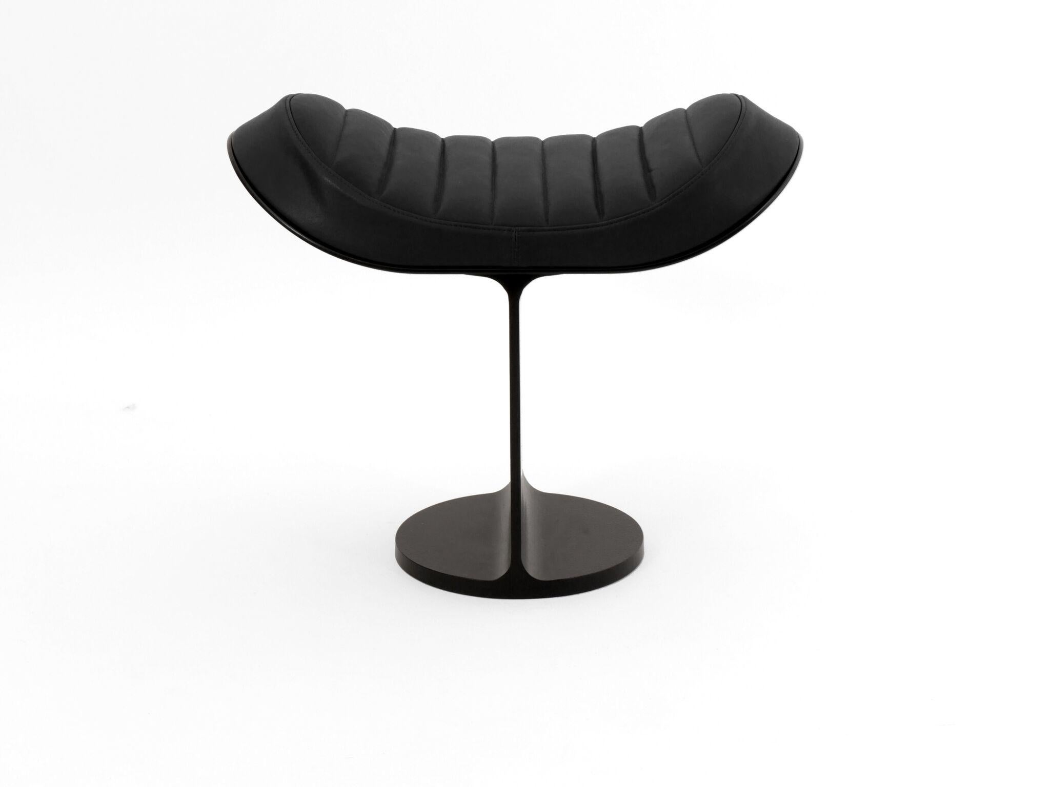 T-beam shaped minimalist design stool with powder coated finish metal base and leather upholstered seat. Designed by Christophe de la Fontaine.