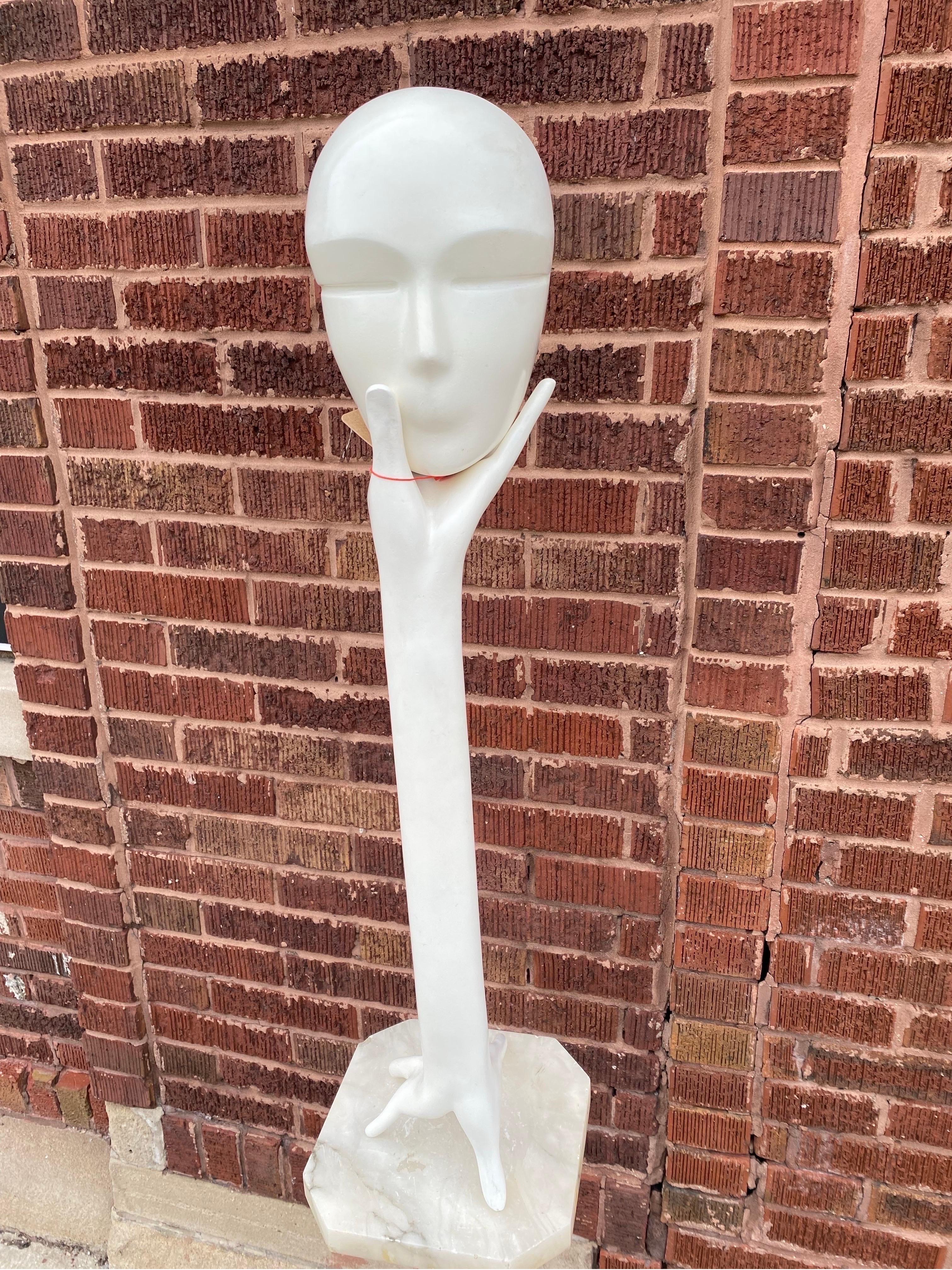 Head-in-Hand 1990s Tall White Sculpture

This white painted wood sculpture depicts an arm with a stretched out hand on either end. A head balances on the hand’s fingertips. The head is not attached to hand. It would be an artistic hat stand for your