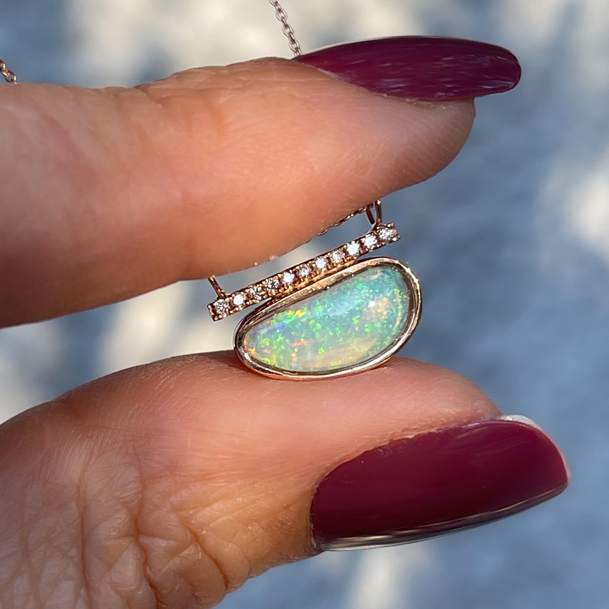 A breathtaking green opal shimmers with charm in the Head in the Clouds Crystal Opal Necklace No. 16.  The crystal opal dons a delicate pinfire pattern drawing on childhood memories of fairy dust and enchantment.  Through this entrancing green