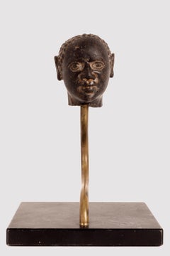 Head of a man in black granite, iron base, Russia, early 18th century.