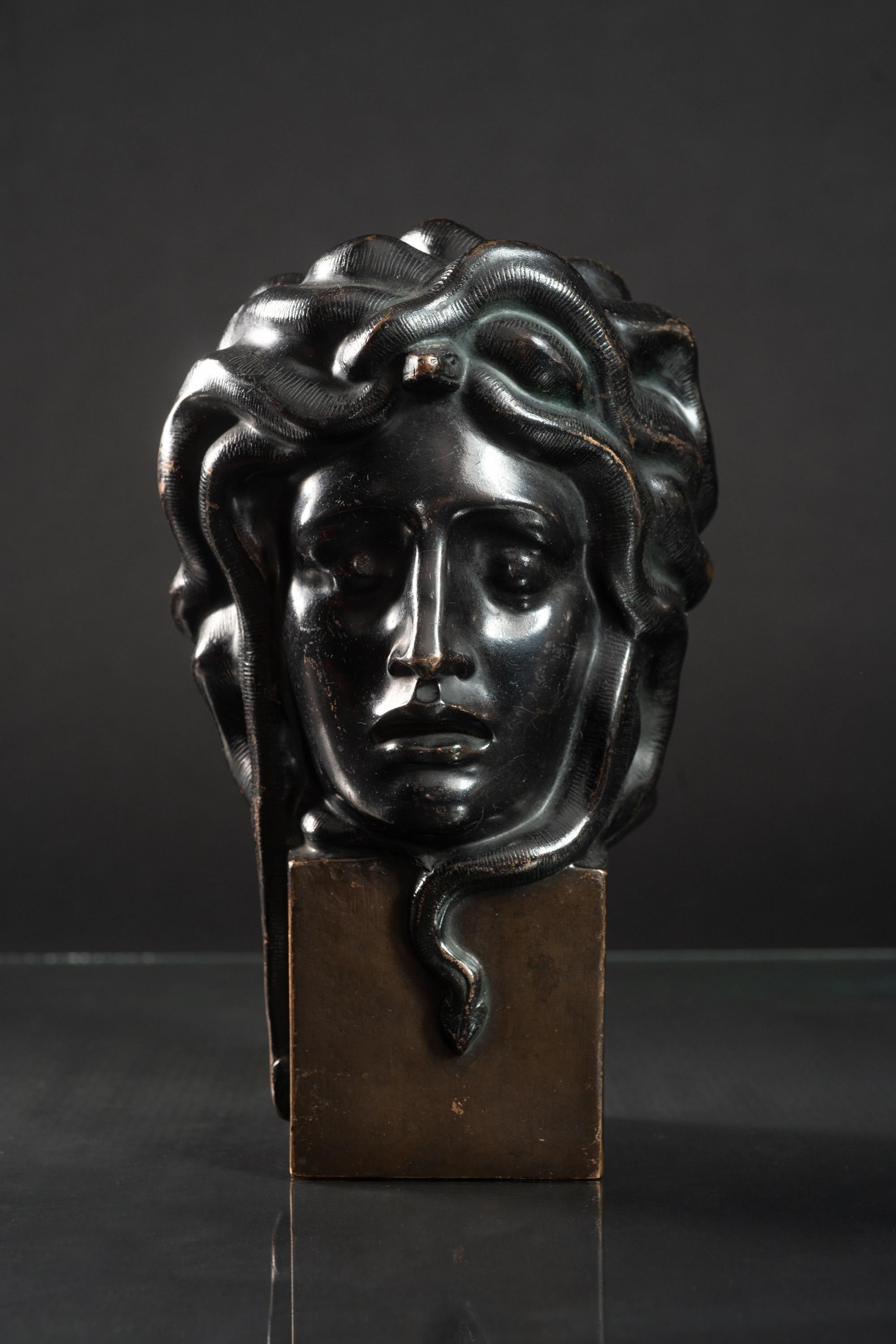 This Medusa head was marked J. Müllner, dated 1918 and stamped ‘Österr. Gesellsch. Z. Förderung D. Medaillenkunst und Kleinplastik’, with the stamp GMK 16 and Eisengiesserei A. G. Wien. Scuffs.