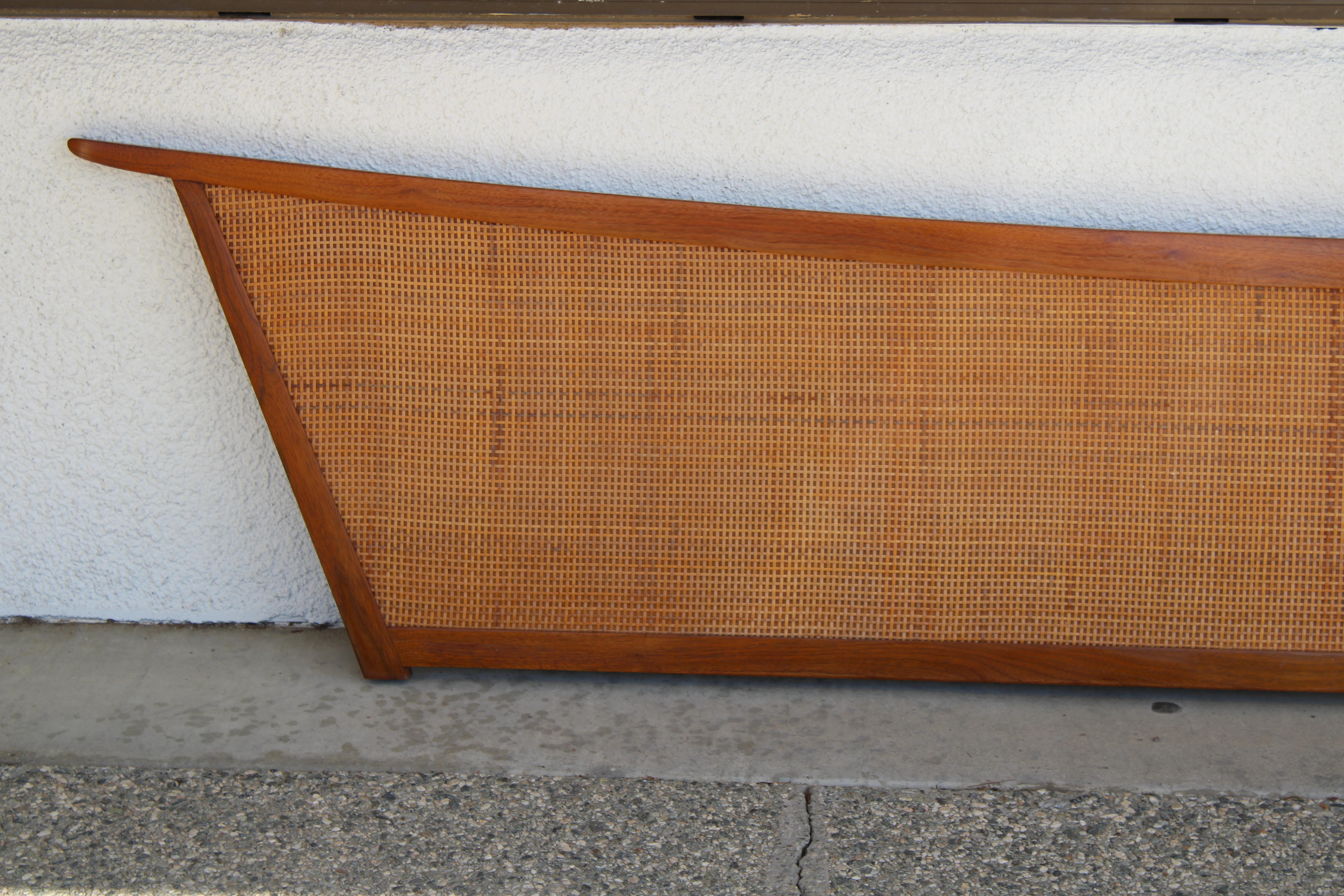 George Nakashima design headboard for a king size bed for his Origins series by Widdicomb.  Constructed of walnut with original woven cane panels.  This is just the headboard.  At one time there was the frame but the owners most likely preferred it