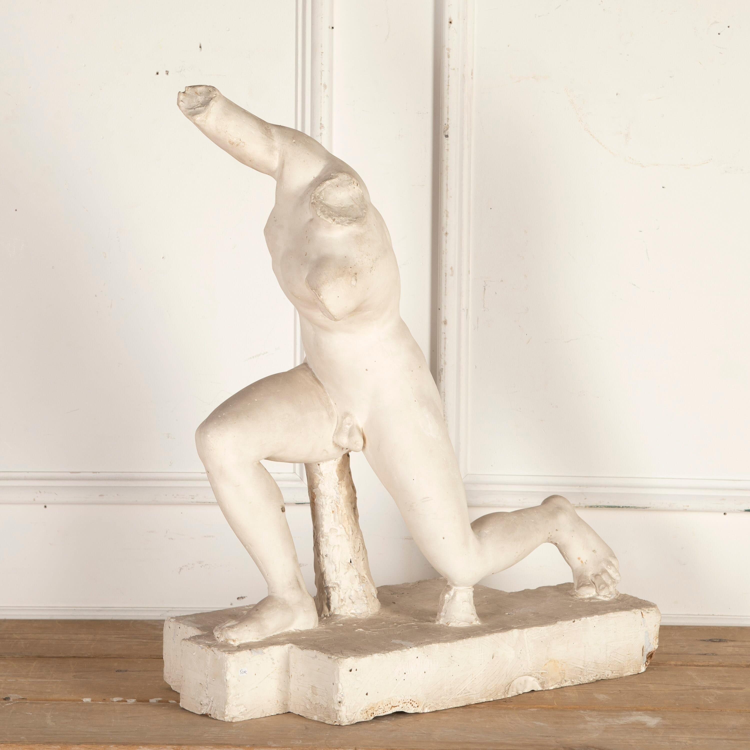 French 19th century plaster statue of a classical figure.

This statue is missing his head and arms, but was likely made after the iconic ancient Greek statue of Discobolus. The original Discobolus of Myron was completed around 460-450 BC and