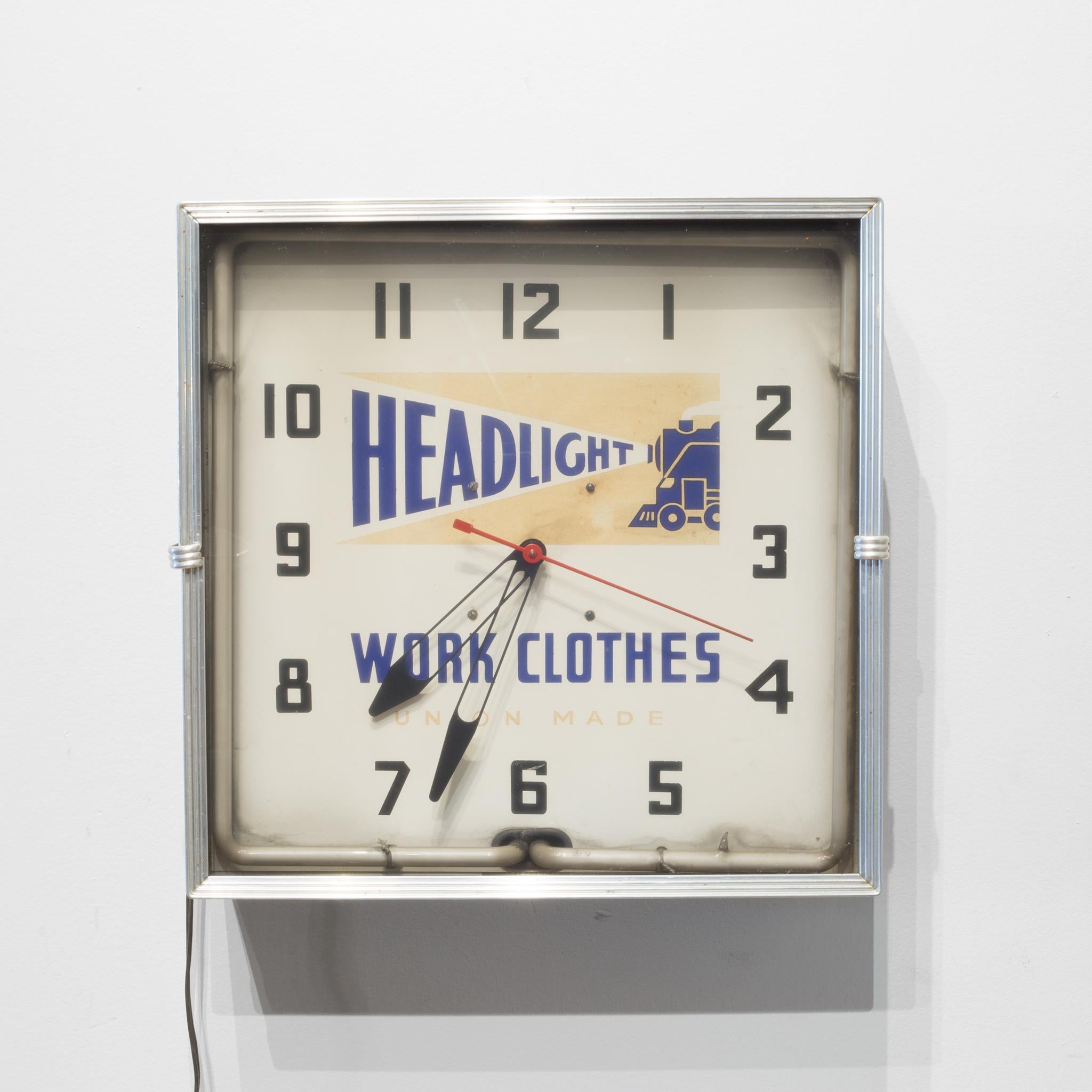 About

An original Headlight Work Clothes Union Made wall clock with Art Deco silver metal trim and neon lighting inside. The clock operates properly and the neon lighting is also fully functional. A date stamp on the back reads 