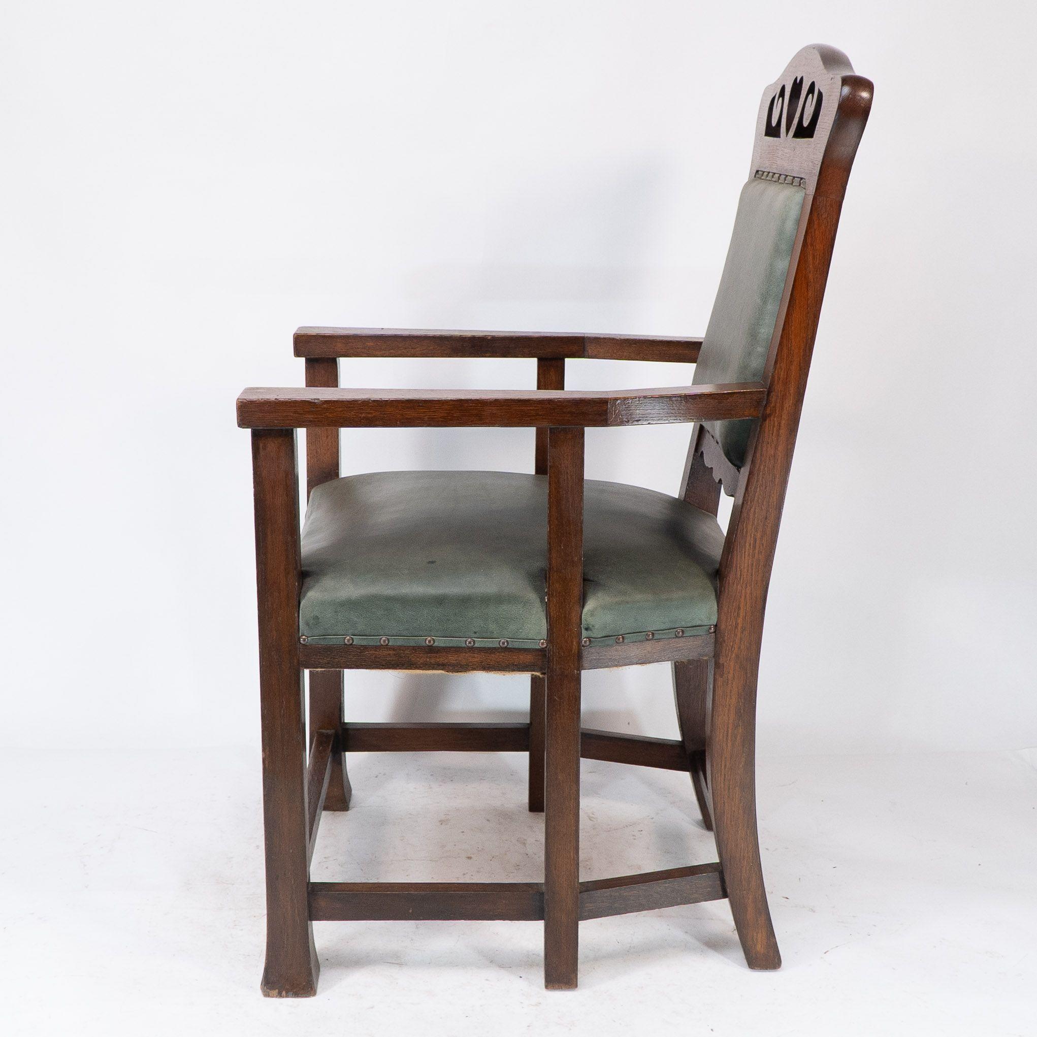 Oak Heal and Son (attributed). An Arts and Crafts six-legged oak armchair For Sale