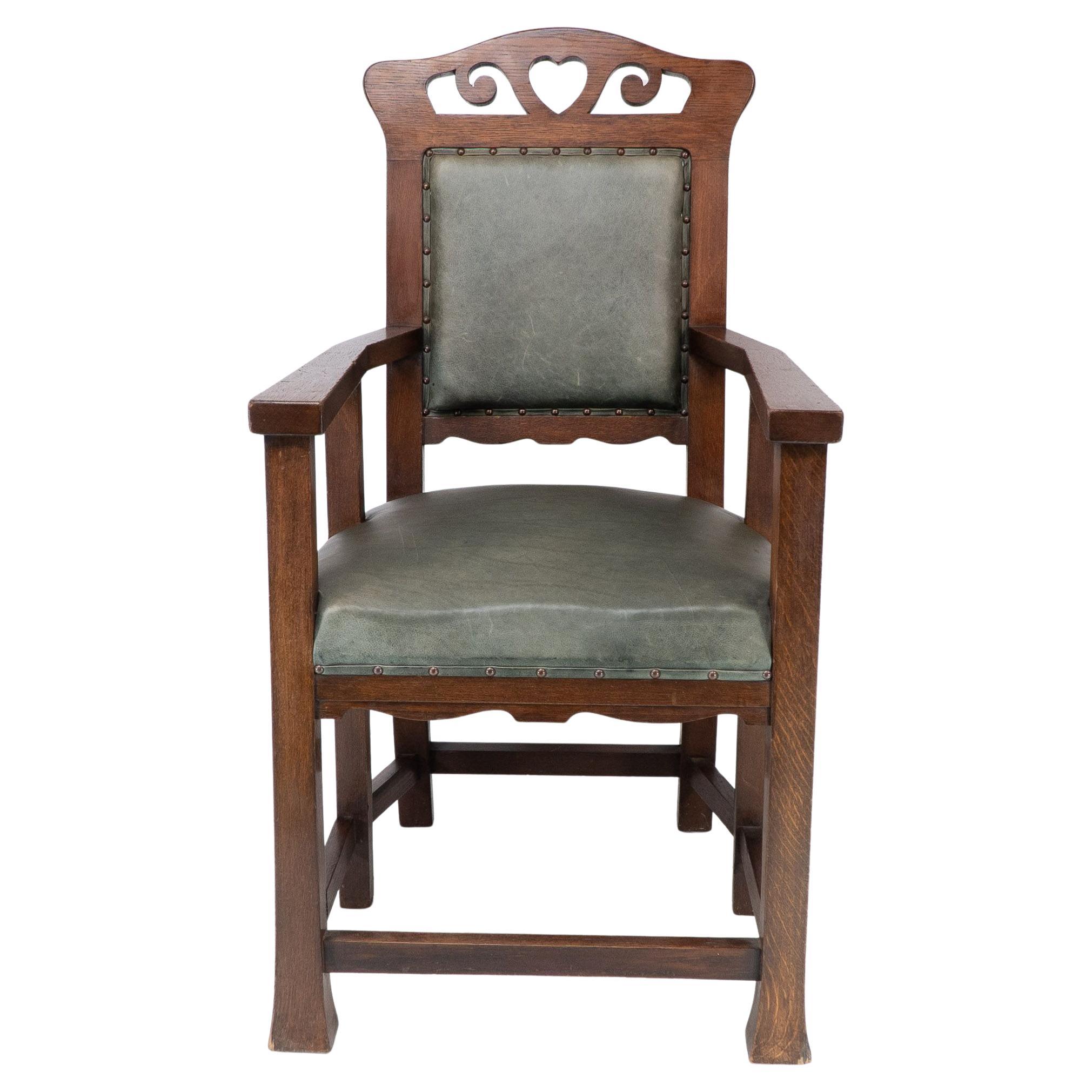 Heal and Son (attributed). An Arts and Crafts six-legged oak armchair