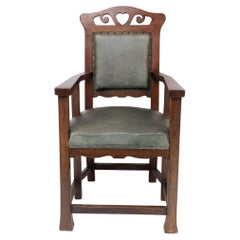 Heal's und Sohn (zugeschrieben). Ein sechsbeiniger Sessel aus Eiche im Arts and Craft-Stil