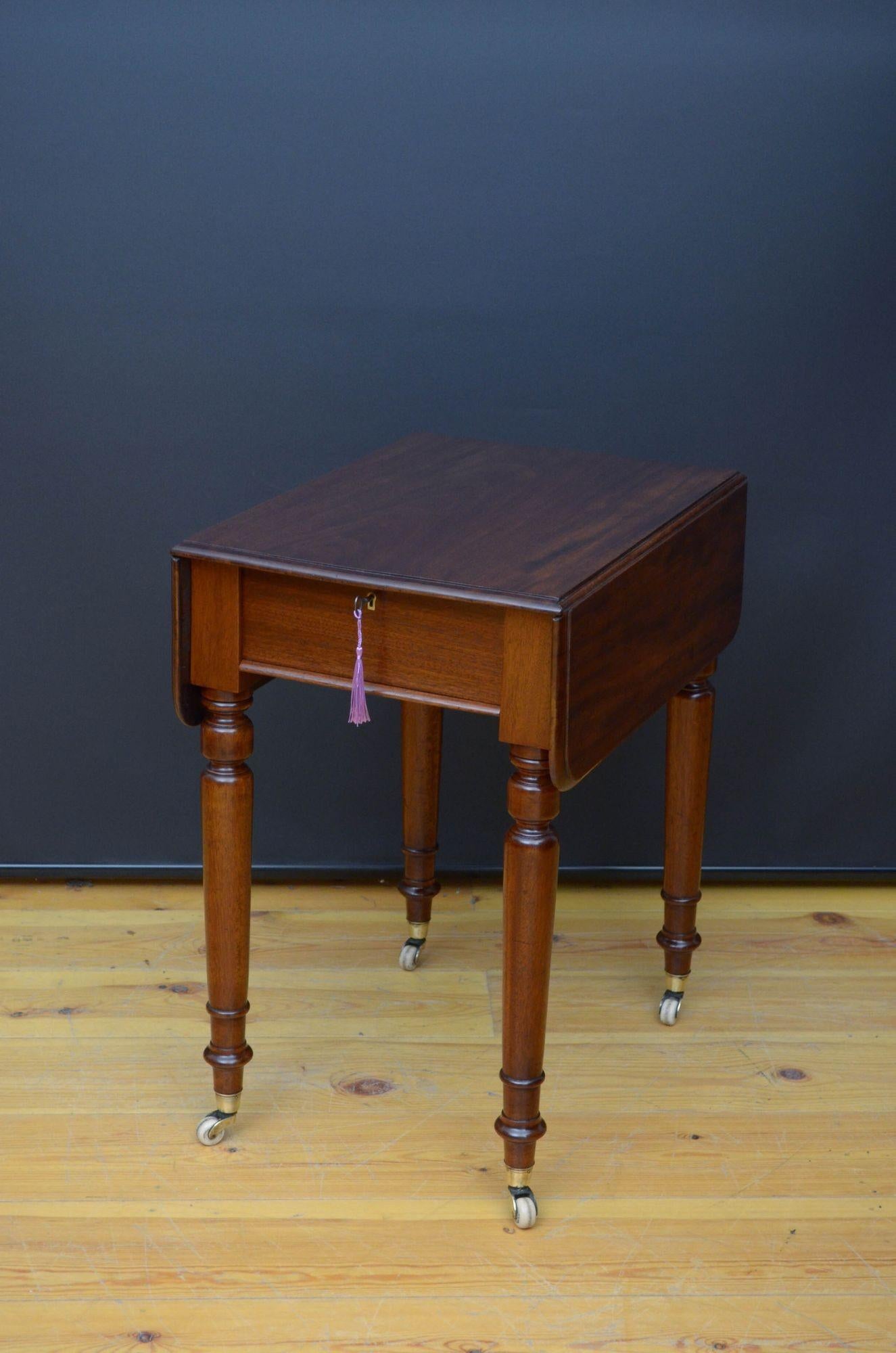 St044 Fine quality early Victorian drop leaf table by Heal & Son London, having figured mahogany top with moulded edge above a mahogany lined draw with original working lock and a key, stamped by the maker, all standing on turned legs terminating in