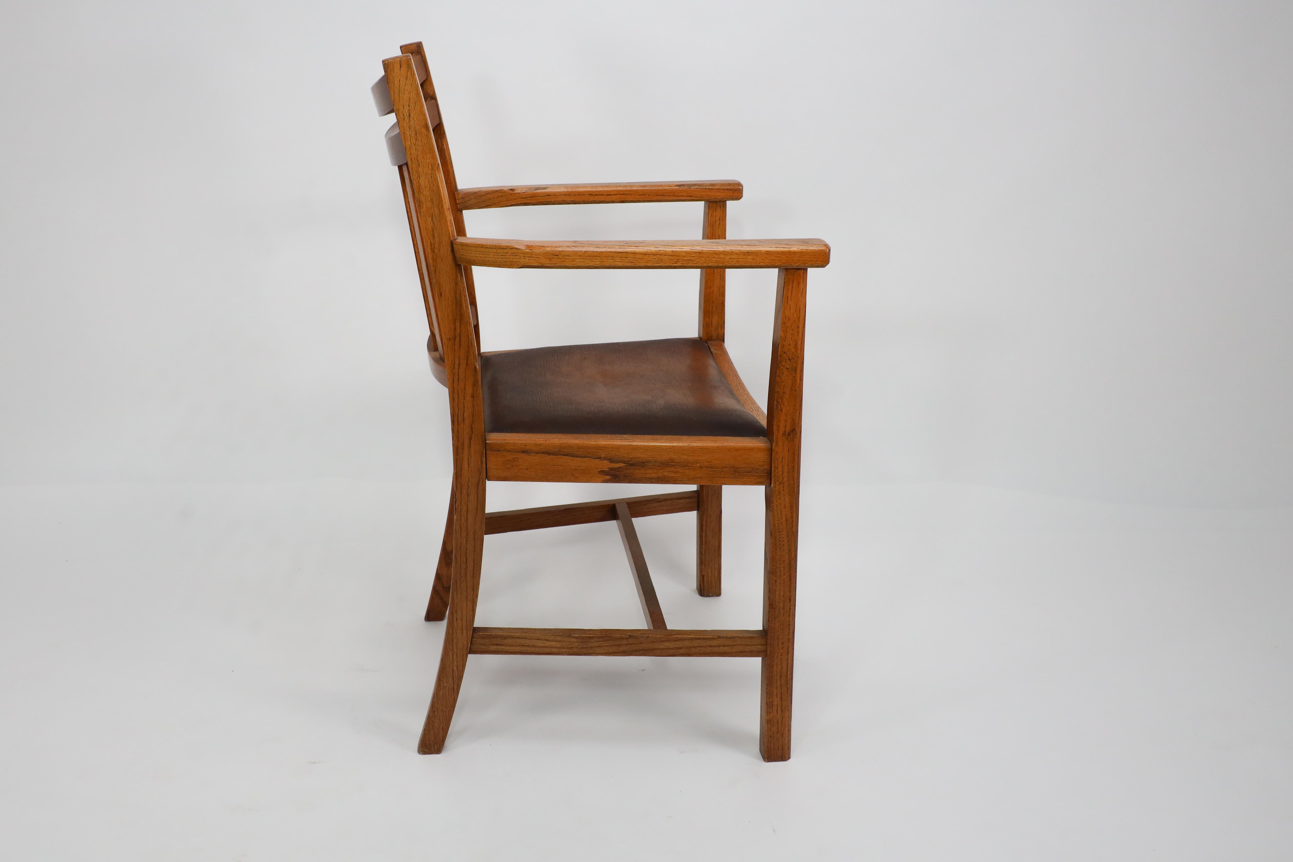 English Heals. A good quality Arts and Crafts oak armchair with chamferred details For Sale