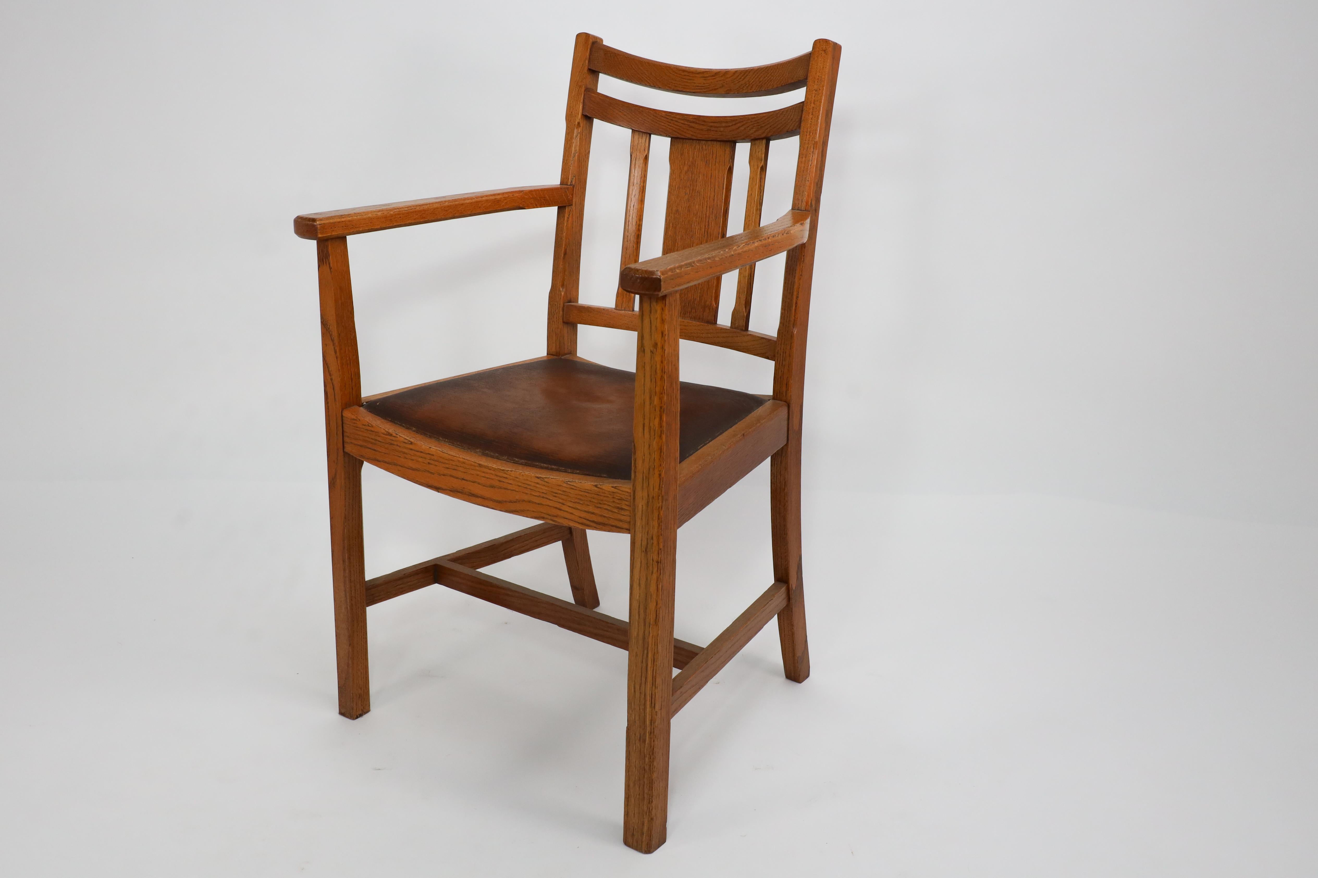 English Heals. A good quality Arts and Crafts oak armchair with chamferred details For Sale
