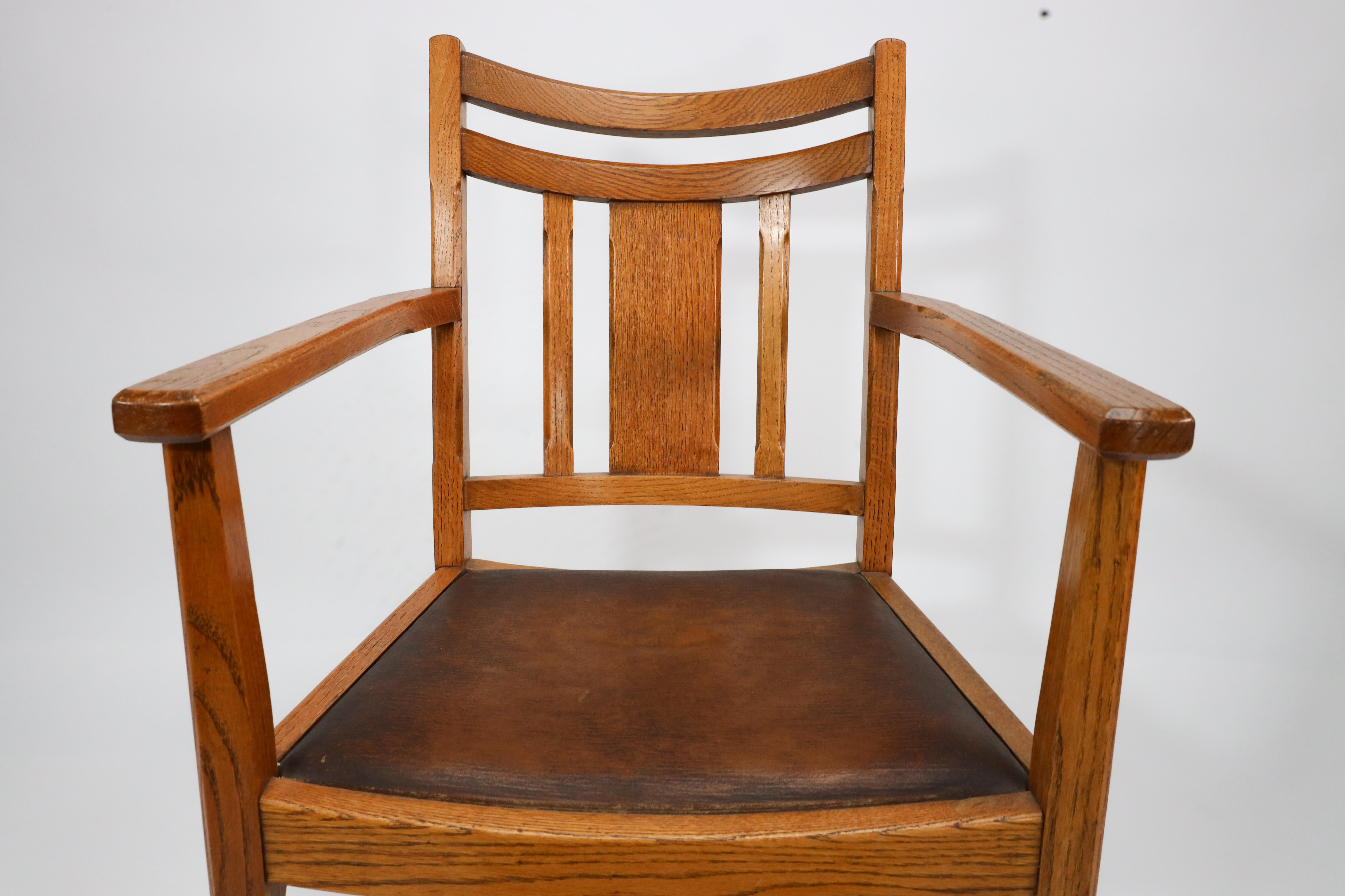 Oak Heals. A good quality Arts and Crafts oak armchair with chamferred details For Sale