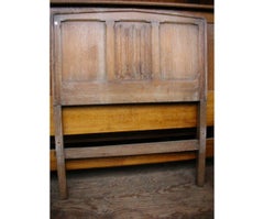 Heals, an Arts and Crafts Limed Oak Single Bed with Linenfold Carved Details