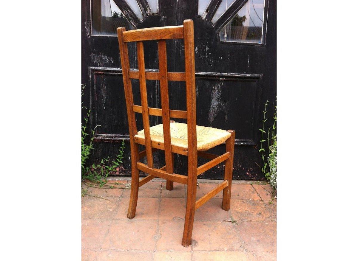 Arts and Crafts Heals, an Arts & Crafts Oak Rush Seat Lattice Back Side Chair