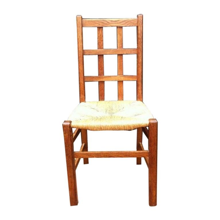 Heals, an Arts & Crafts Oak Rush Seat Lattice Back Side Chair