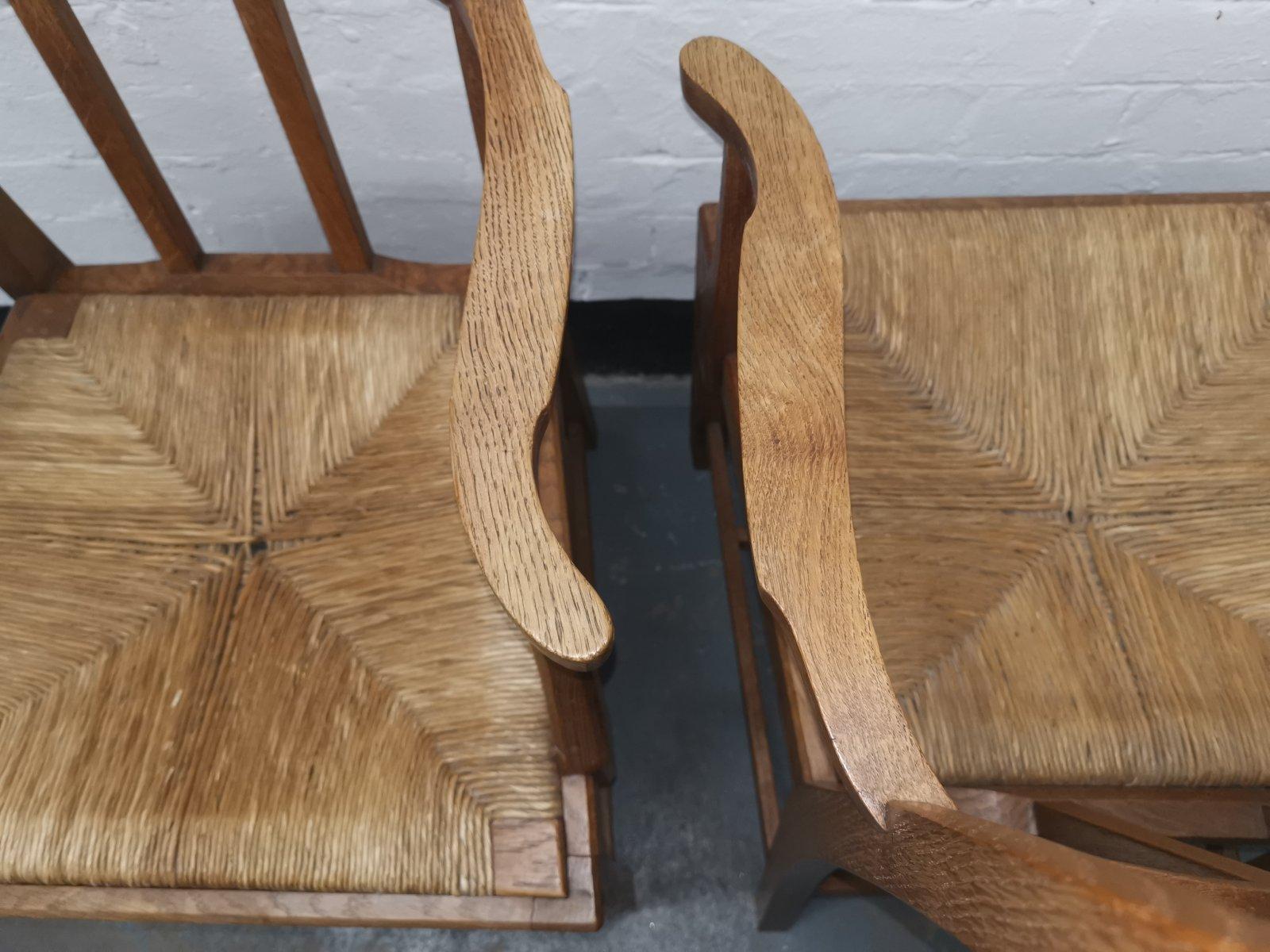 20th Century Pair of Cotswold School Arts & Crafts Oak Lattice Back Armchairs with rush Seats For Sale
