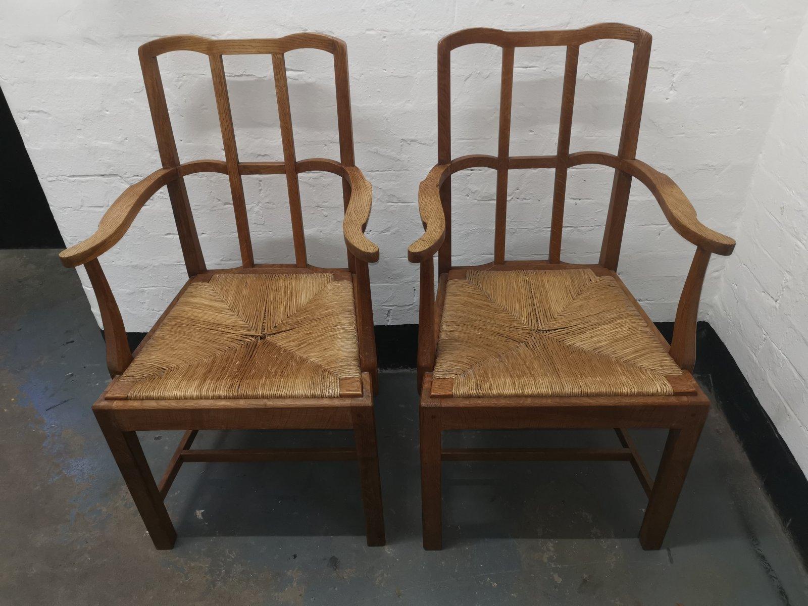 English Pair of Cotswold School Arts & Crafts Oak Lattice Back Armchairs with rush Seats For Sale
