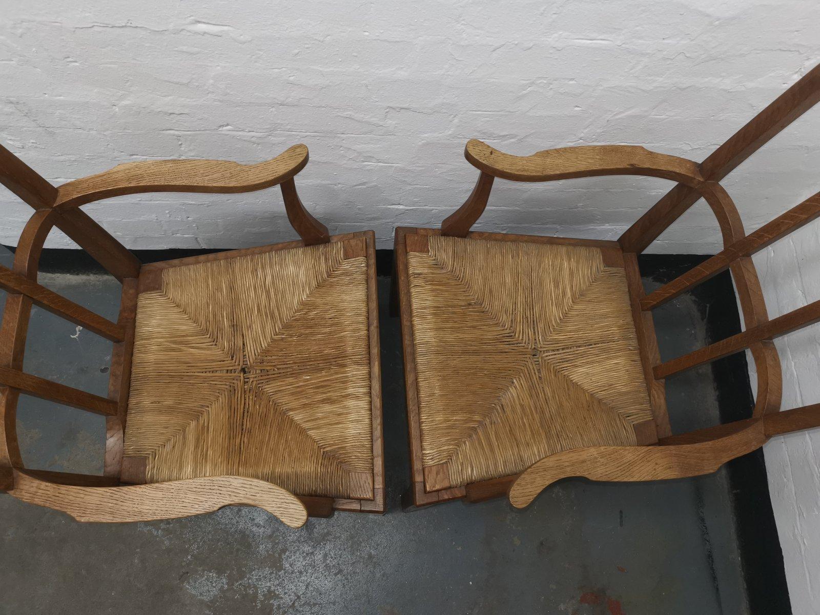 Pair of Cotswold School Arts & Crafts Oak Lattice Back Armchairs with rush Seats In Good Condition For Sale In London, GB
