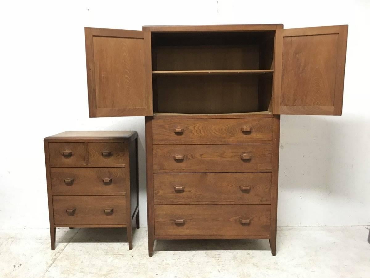 Betty Joel, attributed, an Arts & Crafts oak tallboy and matching petite chest of drawers with hand crafted handles and angled feet.
Tall boy measures H 62 1/2