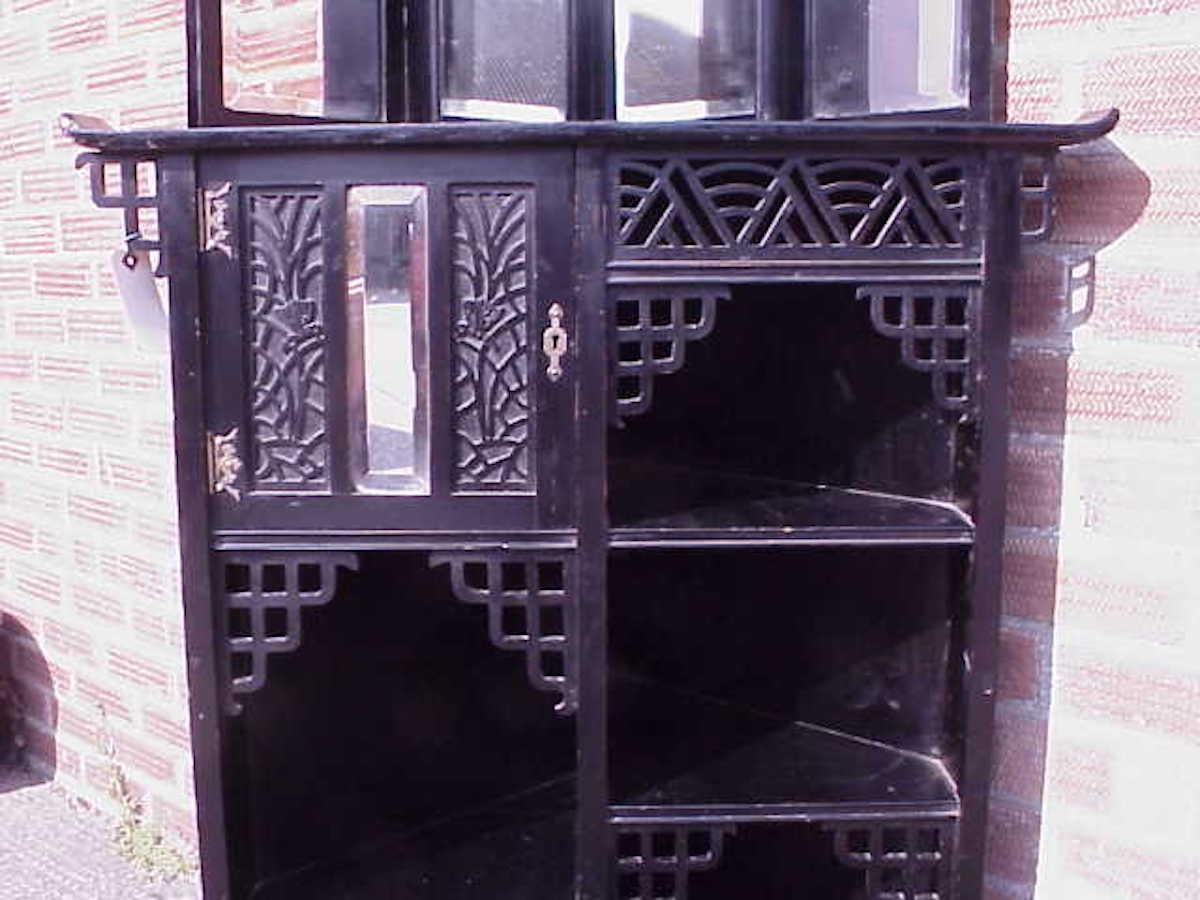 Ebonized Heals, Attributed an Anglo-Japanese Aesthetic Movement Butterfly Corner Cabinet For Sale