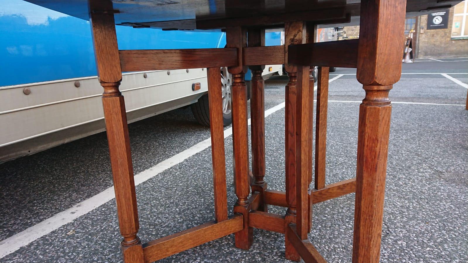 Arts and Crafts Heals, Attributed, An English Arts & Crafts Oak Drop Leaf Hexagonal Dining Table For Sale