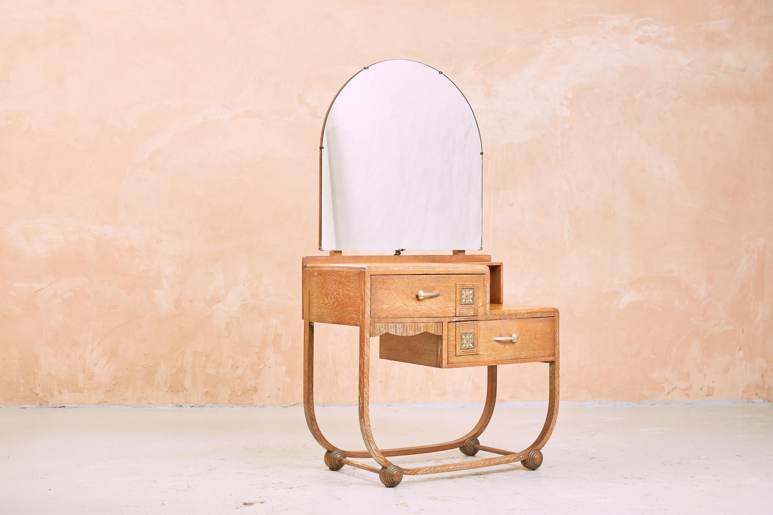 Art Deco limed oak bedroom suite by Heals

This very stylish bedroom suite has most fortunately survived in excellent condition, each piece has its original chrome and green bakelite handles and they all have two very stylish decorative embossed and