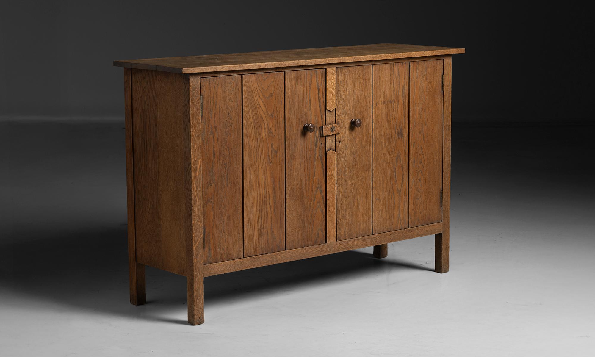 England, 1910
Oak sideboard by Heals of London with carved wooden lock and paneled doors.
54”L x 17.25”d x 36”h
Ref. CFRN1375
$ 6,800