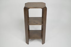 Heals of London (attributed). A late oak three tier book table or wotnot