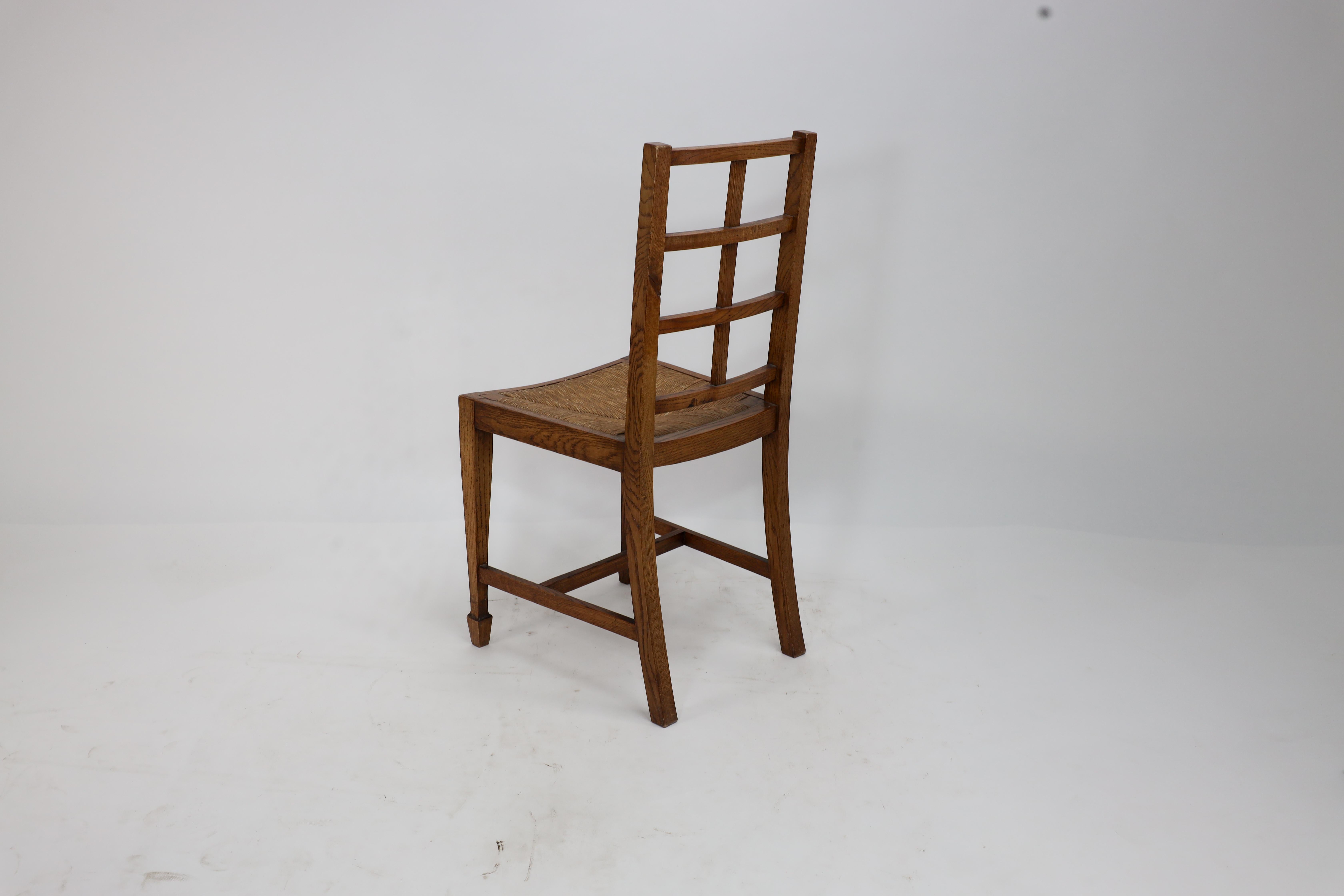 Heals of London, attributed. An Arts & Crafts oak lattice back side chair For Sale 6