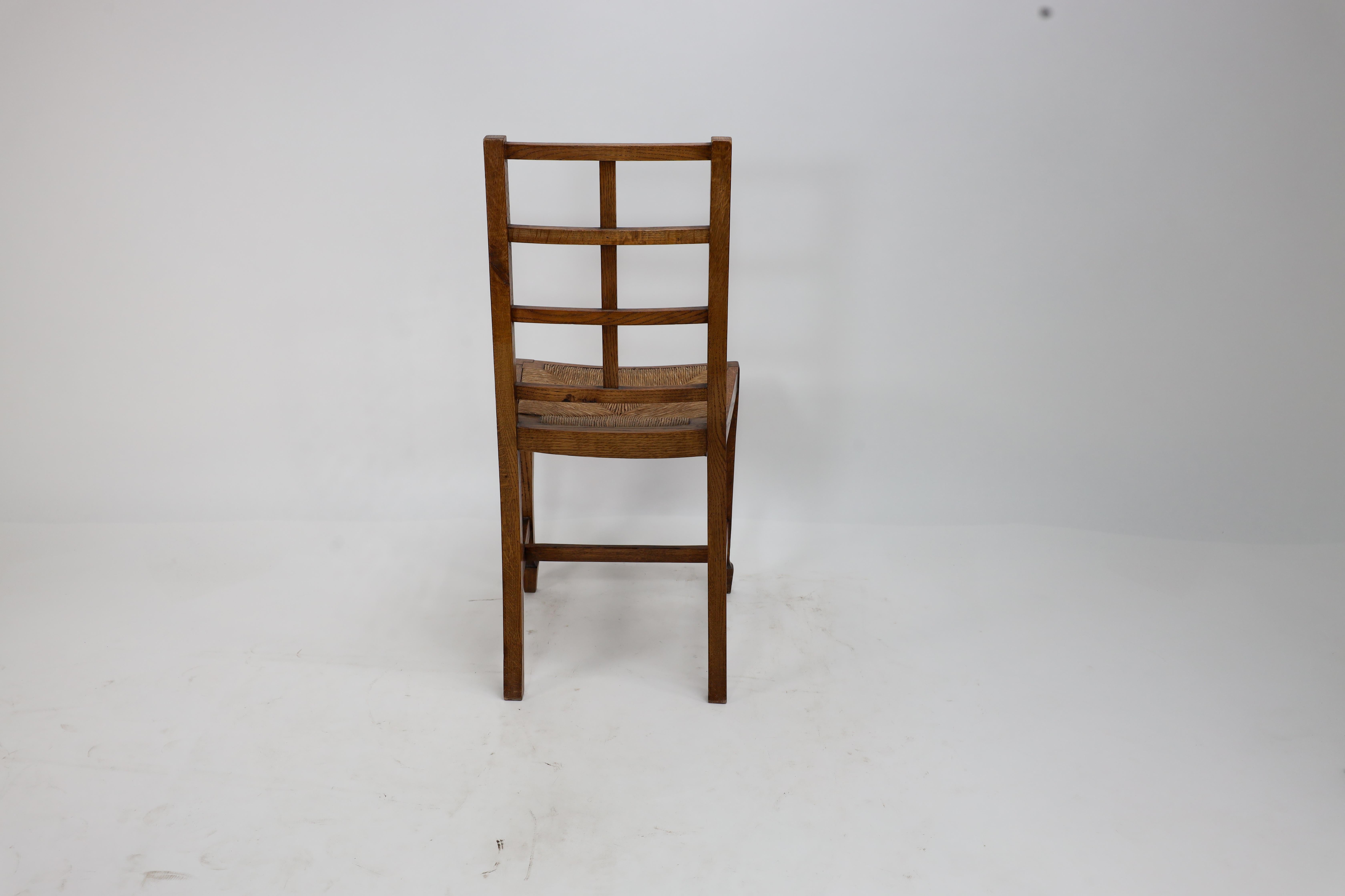 Heals of London, attributed. An Arts & Crafts oak lattice back side chair For Sale 7