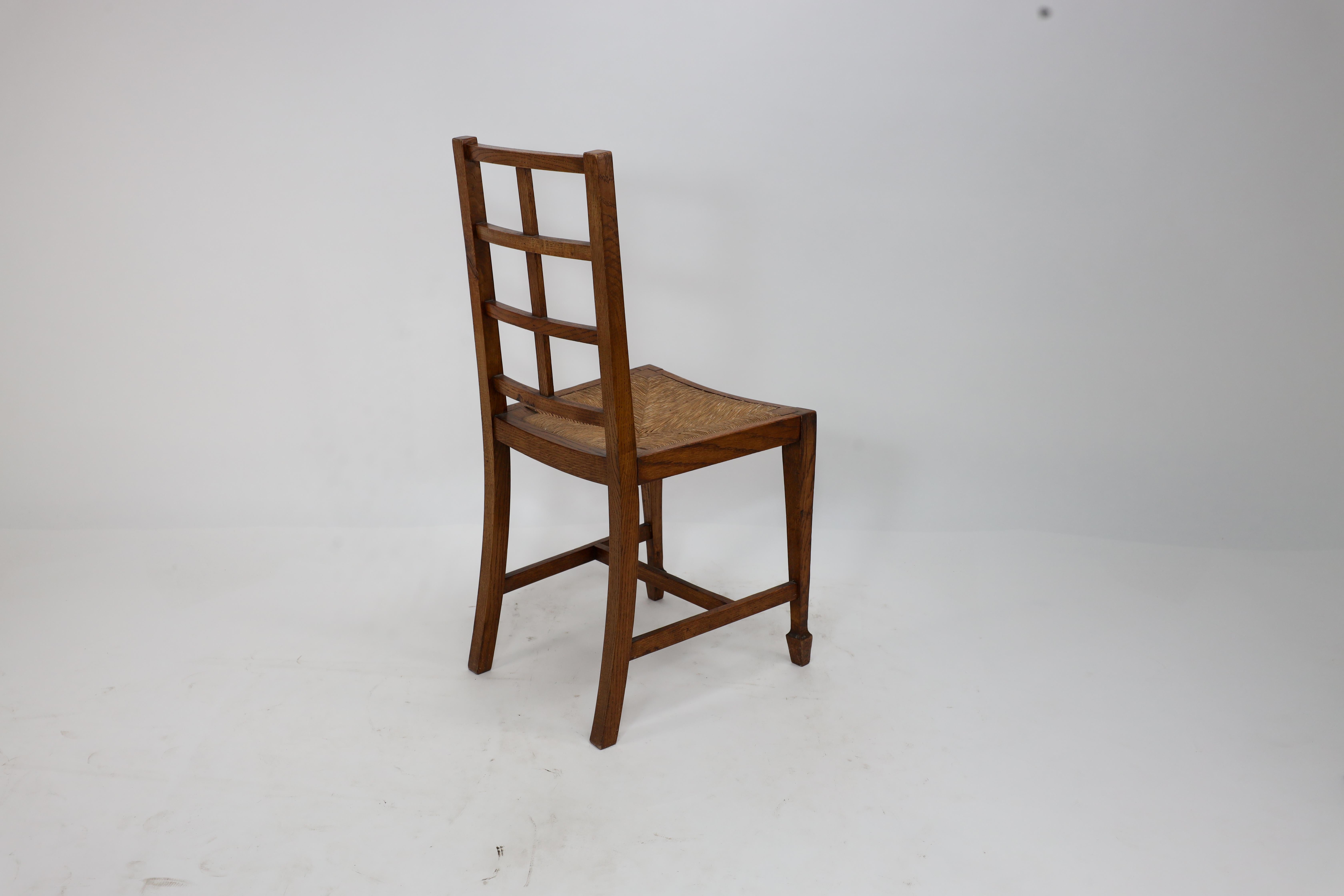 Heals of London, attributed. An Arts & Crafts oak lattice back side chair For Sale 8