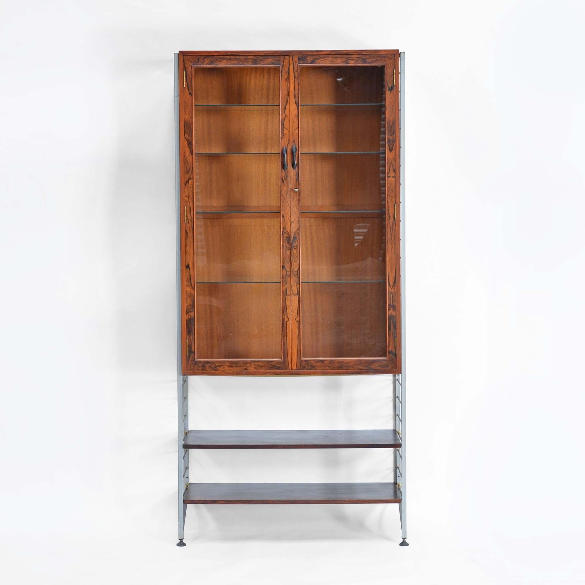 Heals rosewood Ladderax cabinet
The modular Ladderax system where all components are hung from the two ladders, in this case one cabinet and 2 shelves can be hung in any configuration to fit your mood or room.  Created by Robert Heal in 1964 for