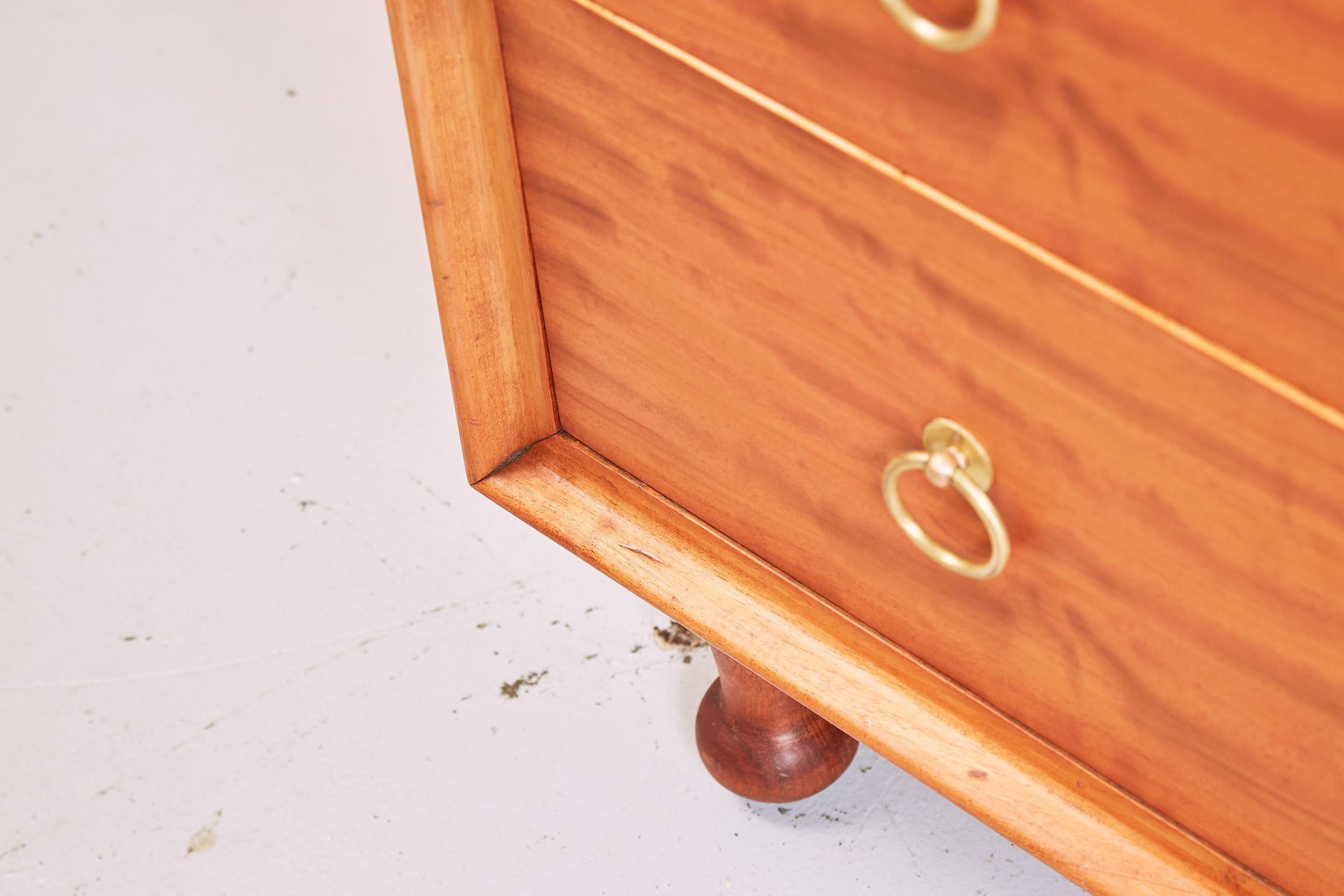 Brass Heals Satinwood Chest of Drawers by A.J. Milne, 1950s For Sale
