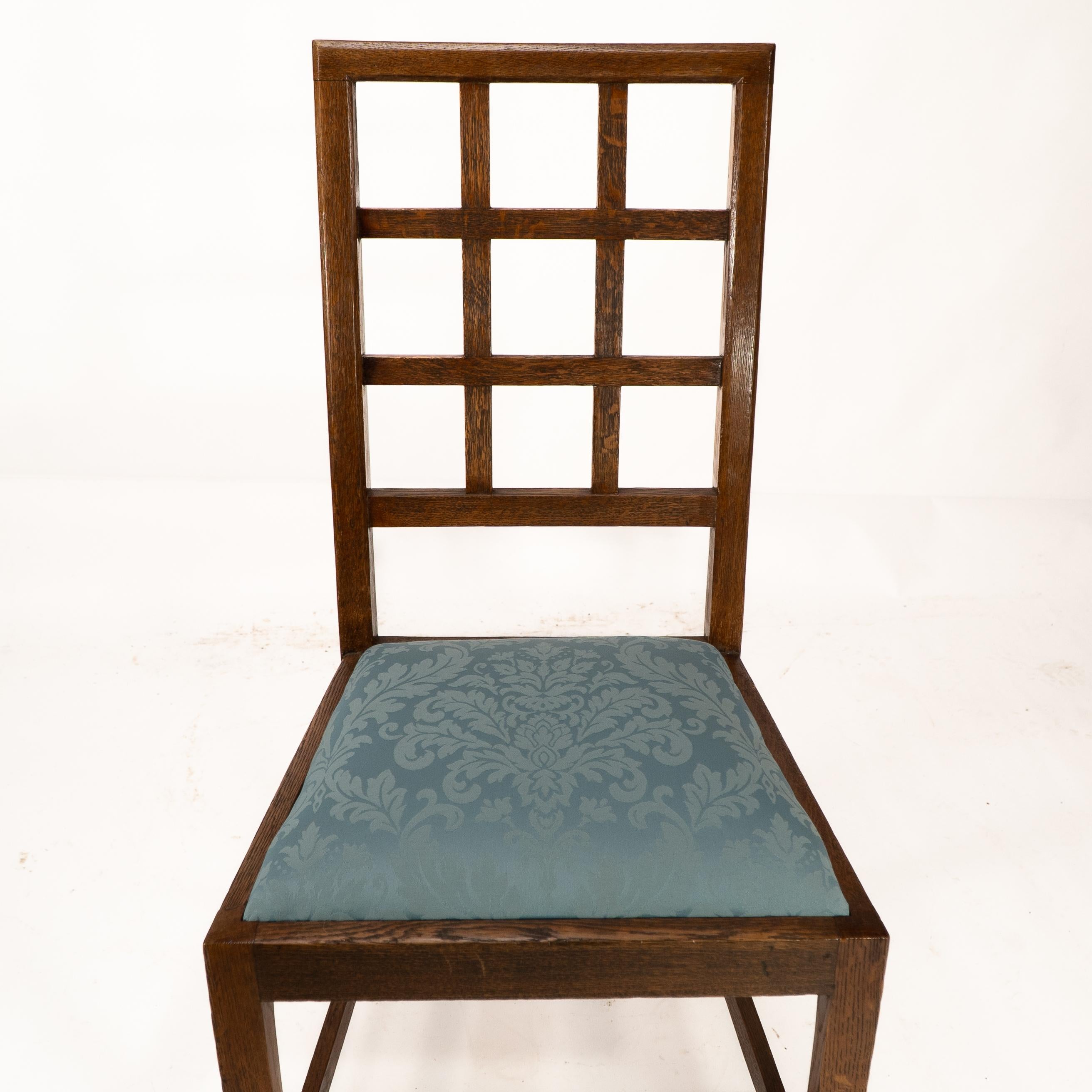 Heals. Set of 4 Arts & Crafts oak lattice back dining chairs & blue Damask seats For Sale 1