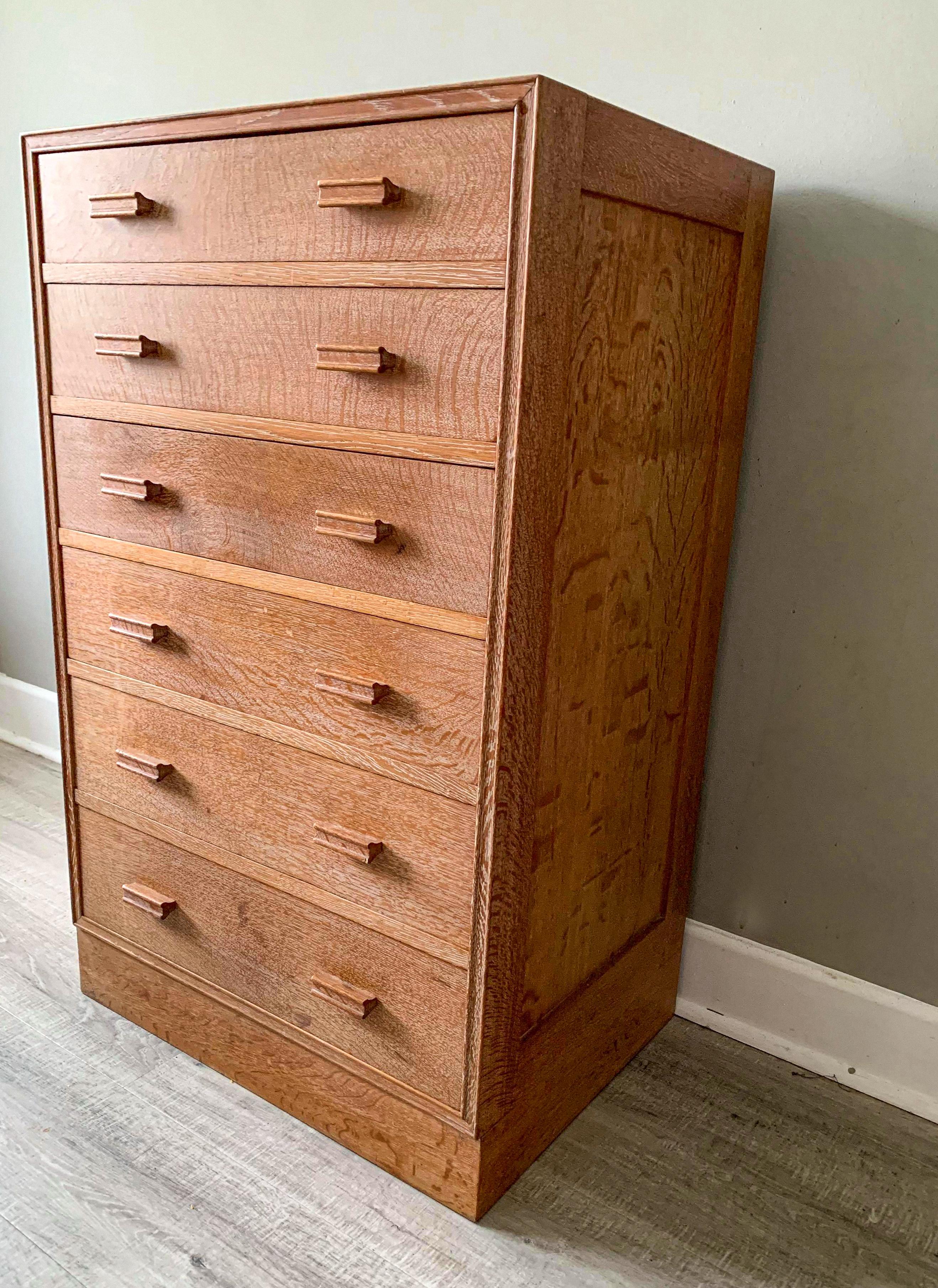 Original Arts & Crafts piece by Heals of London limed oak finish
Tall boy chest of drawers consisting of 6 graduating drawers.
Fabulous piece very rare.
Condition is good with wear in all the right places.
 