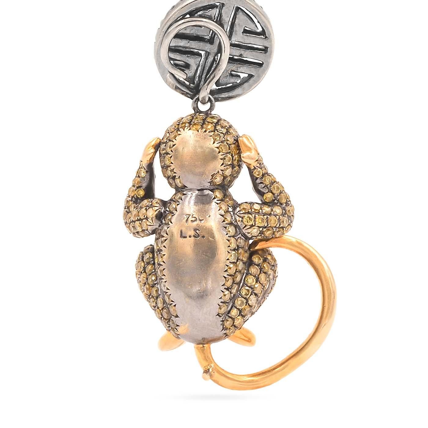 'Hear No Evil' Diamond Monkey Pendant Necklace by Lorraine Schwartz, composed of 18k yellow gold. The pendant depicts a three dimensional monkey with its hands on its ears and is set with approximately 1.70 carats of yellow and white diamonds; with