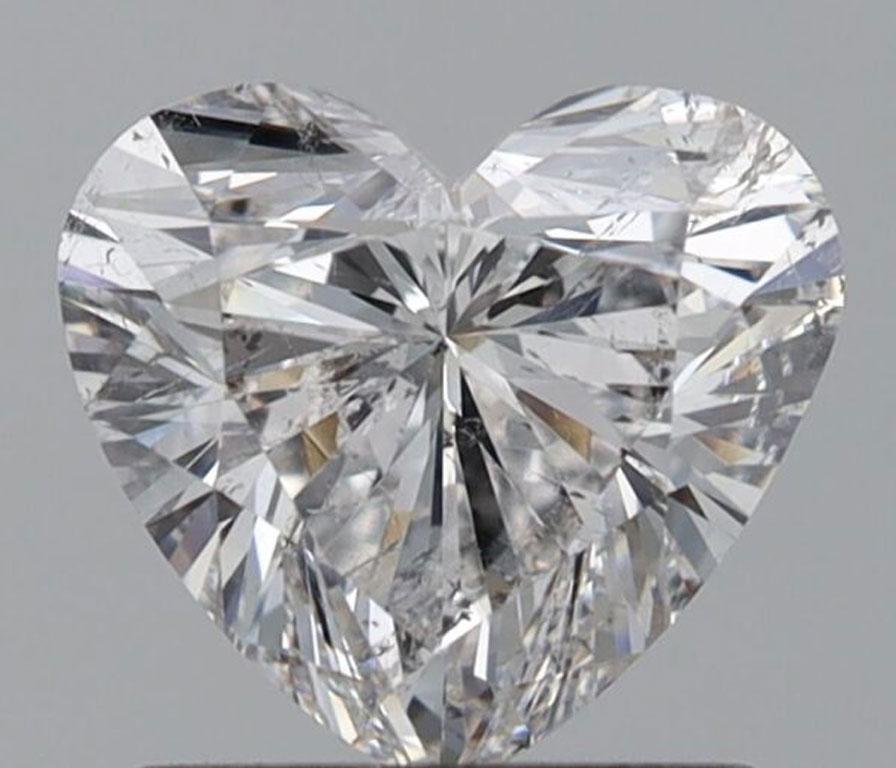 This stunning 1 carat heart-shaped diamond is a timeless symbol of love and elegance. Expertly cut to showcase its brilliant sparkle, the diamond boasts an exceptional E color grade, ensuring it is nearly colorless and radiates pure brilliance. Its