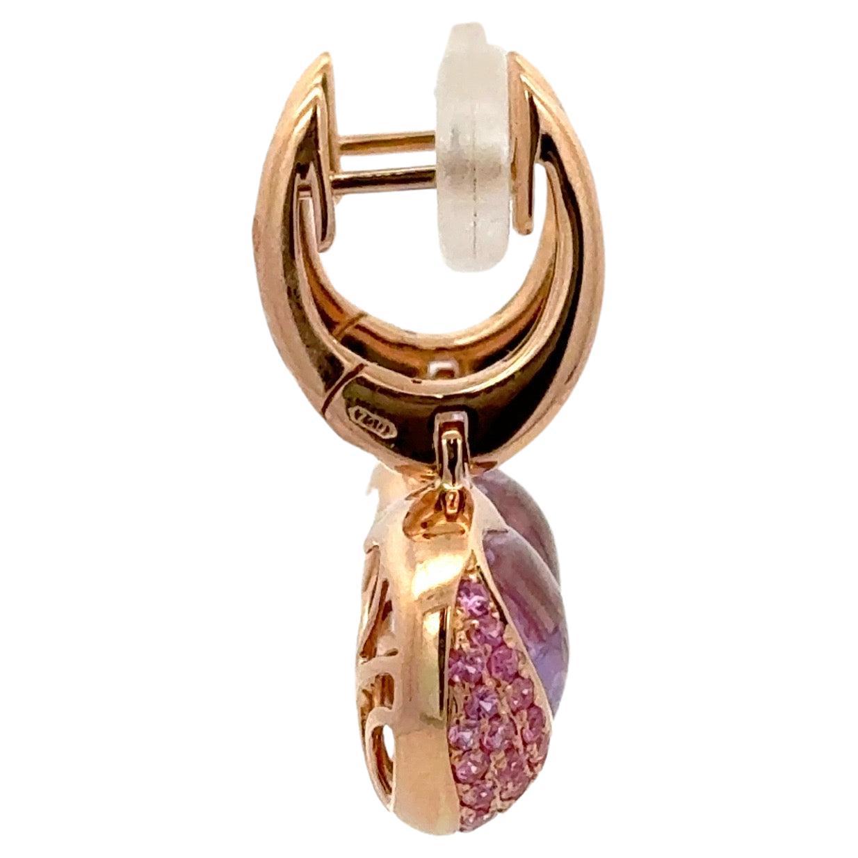 18 Karat Rose gold drop earrings featuring two Amethyst Heart shapes weighing 3.67 carats flanked with 78 Pink Sapphires weighing 0.90 carats, 
Matching Pendant.